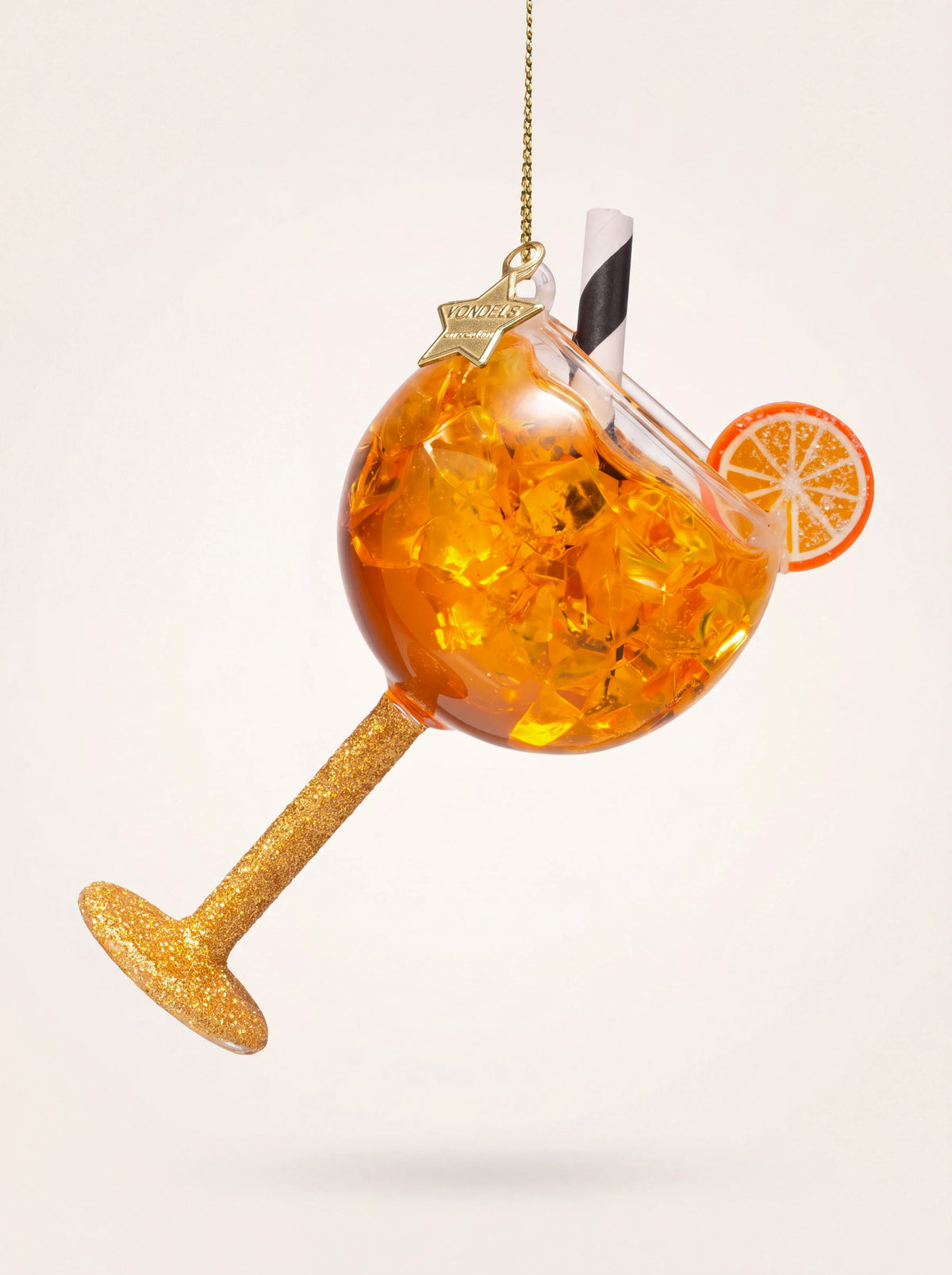 Glass orange spritzer Christmas ornament with ice cubes, an orange slice, striped straw, and glittered stem