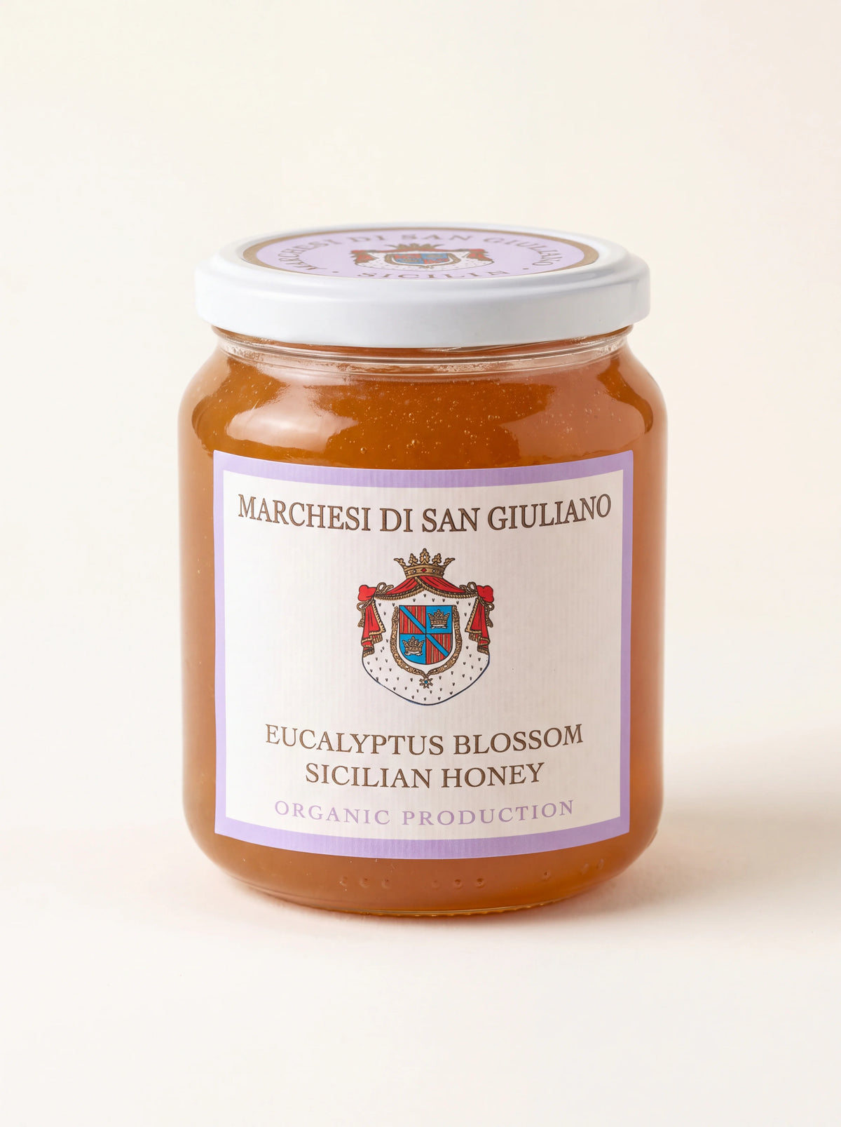 Glass jar of amber eucalyptus honey with label reading Marchesi di San Giuliano Eucalyptus Blossom Sicilian Honey