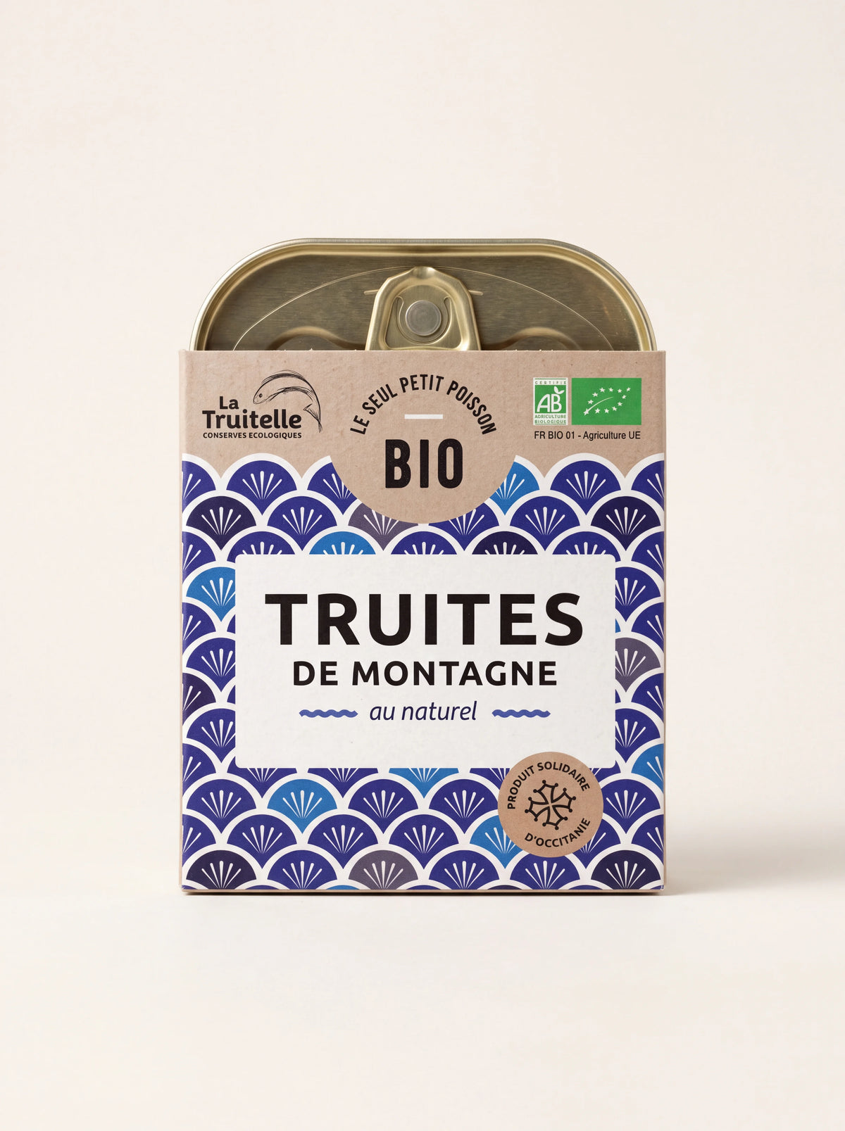 Tin of organic mountain trout with a blue fan-patterned sleeve labelled Truites de Montagne au naturel