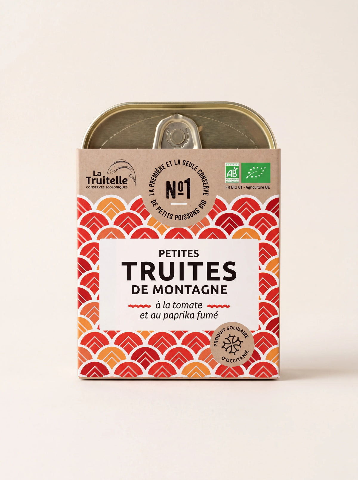 Tinned organic mountain trout in a decorative red and orange patterned sleeve