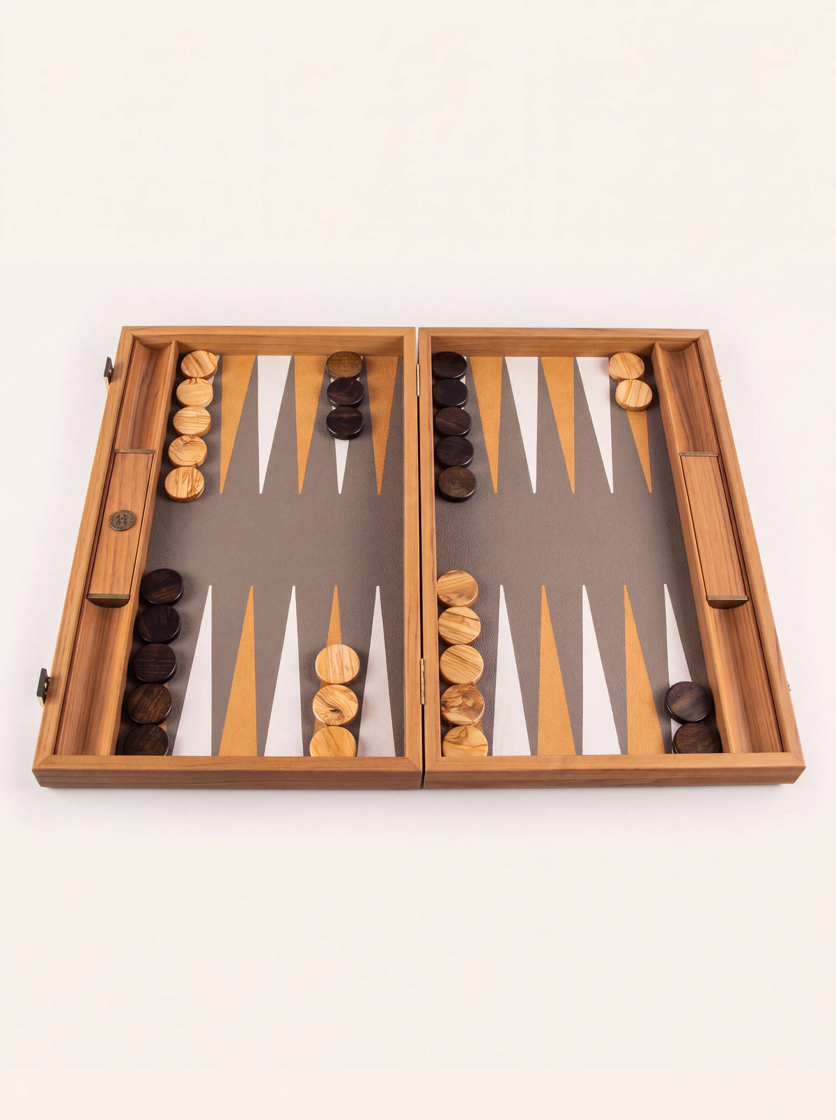 Wooden backgammon set open with light and dark olive-wood checkers on the inlaid board
