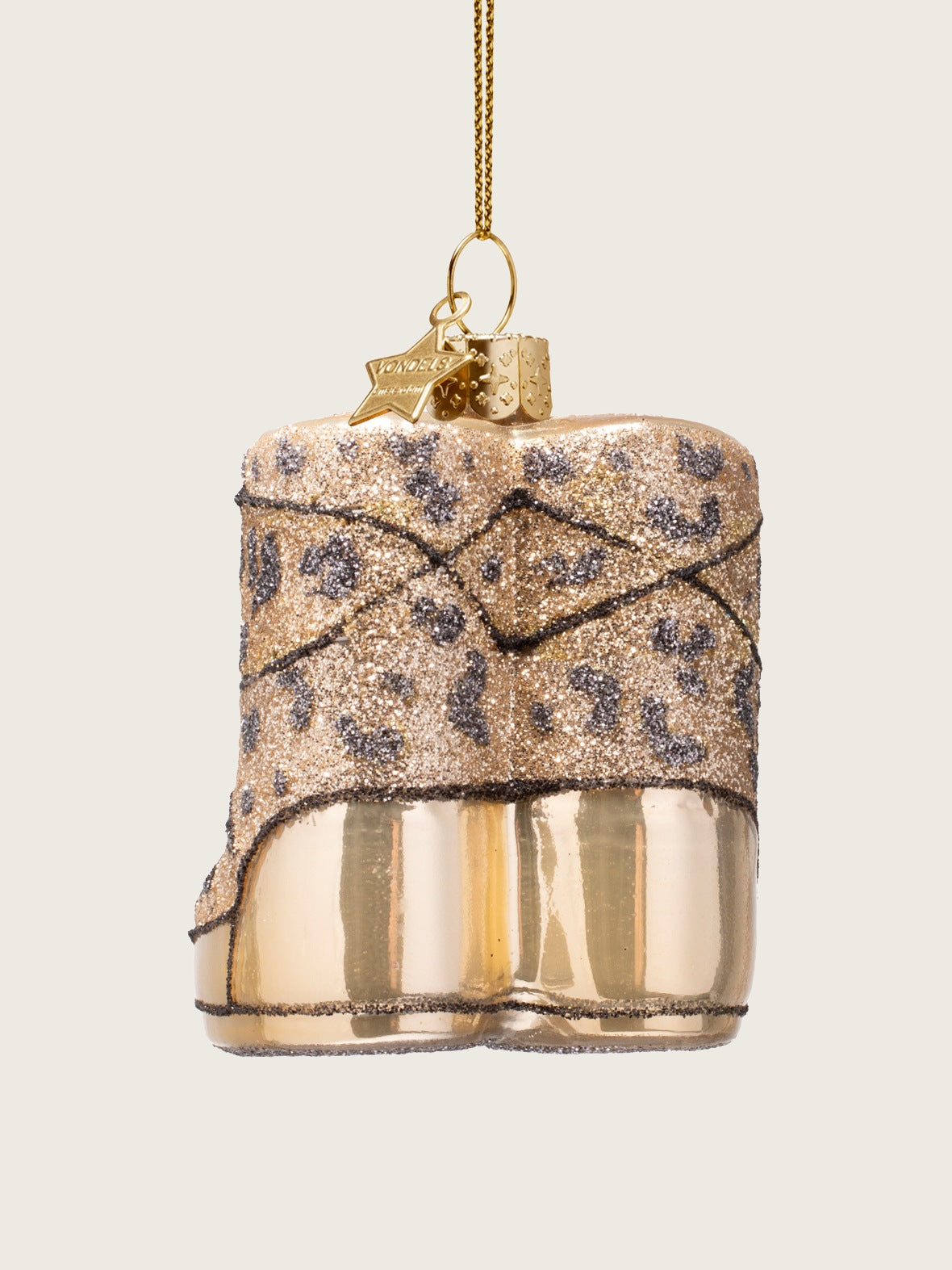 Rear view of the glass snow boots ornament, showing the glossy heels and glittery upper shafts