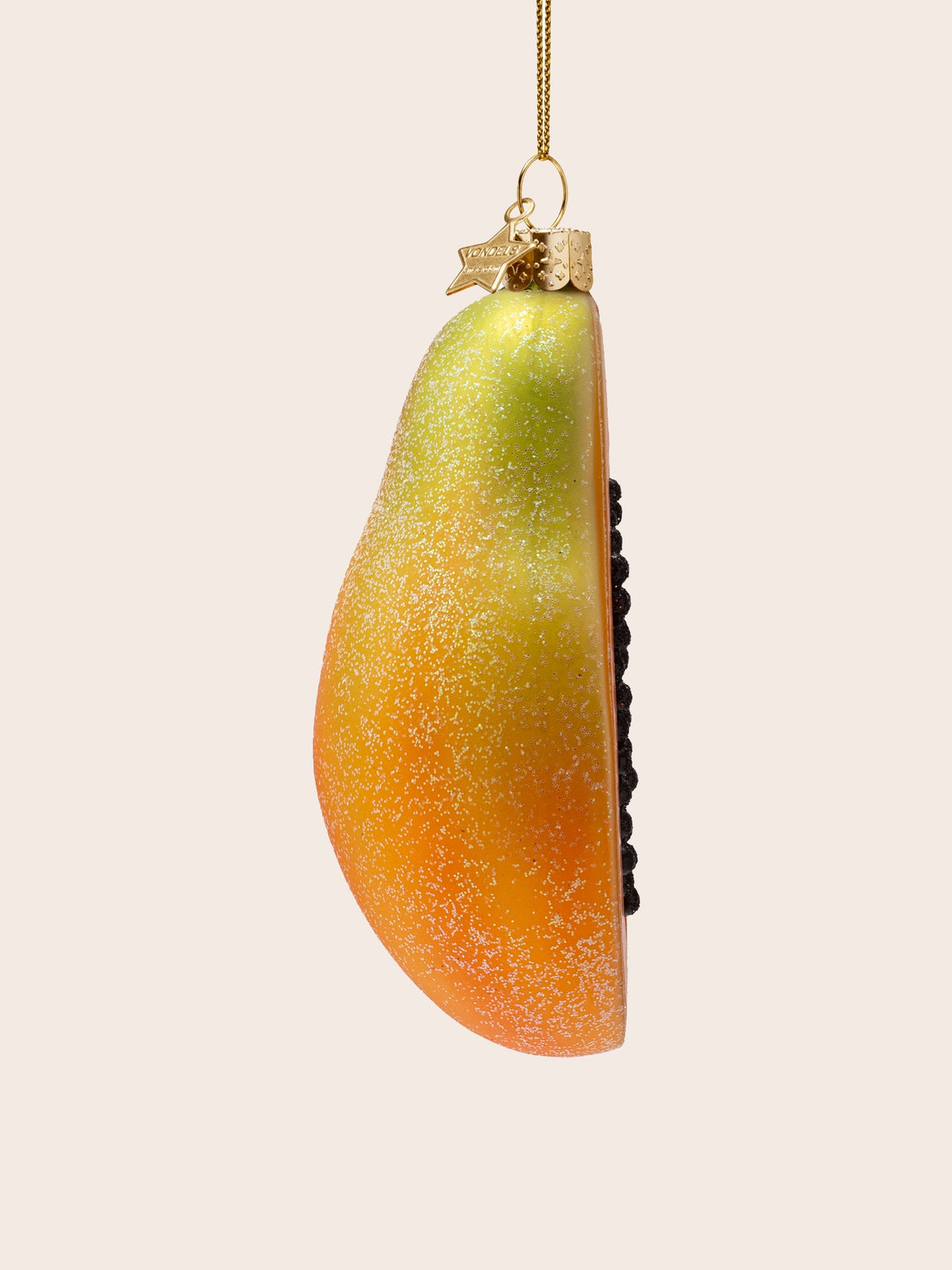 Side view showing the curved outer rind with frosted green and orange shading