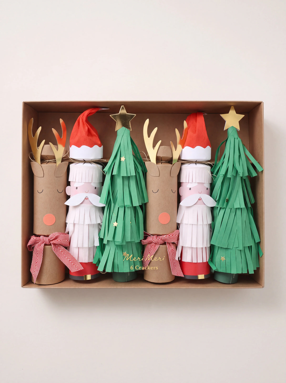 Set of six paper Christmas crackers shaped as reindeer, Santa, and fringed trees in a presentation box