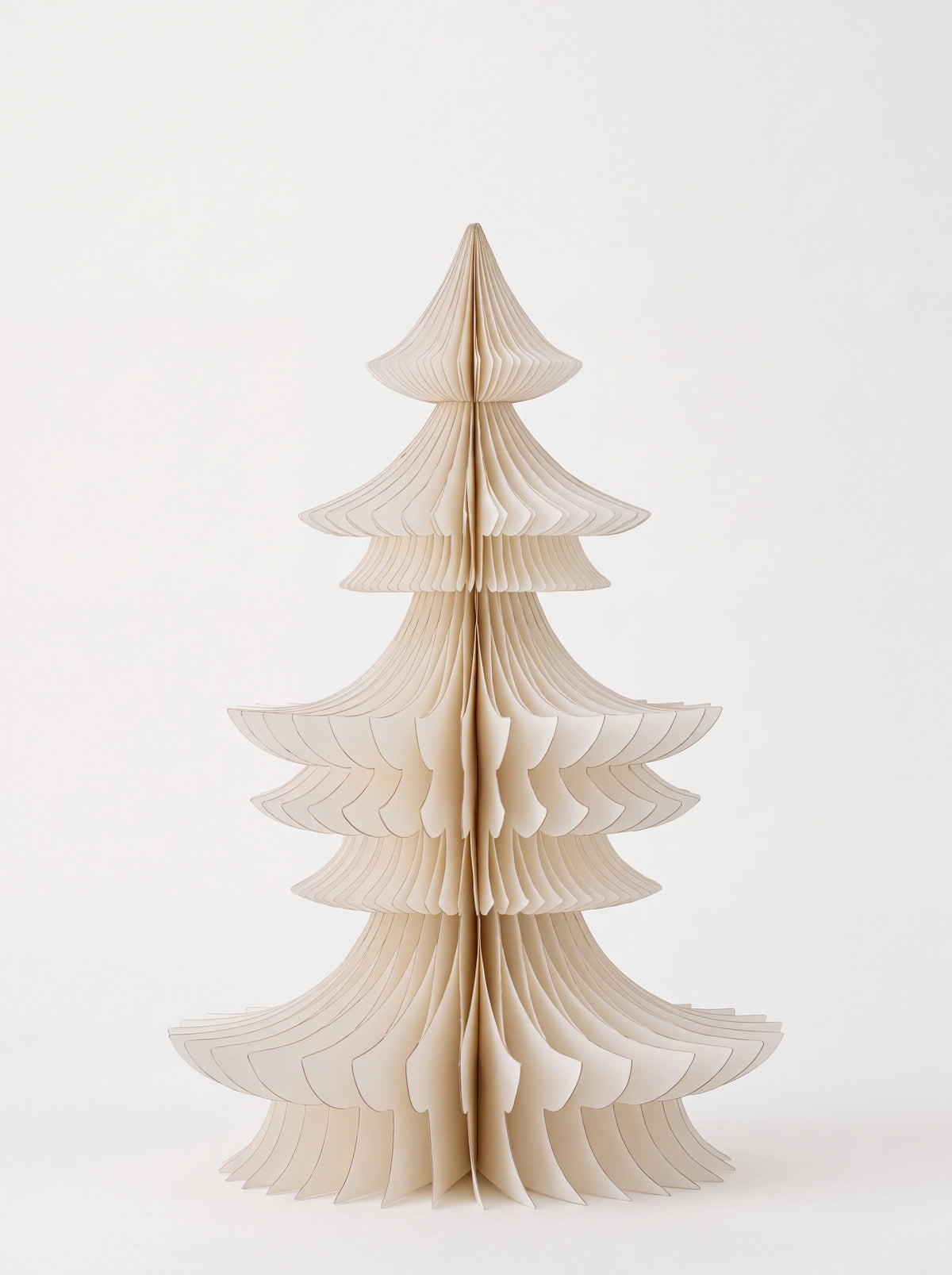 White paper tree with layered accordion folds and gold-toned edges