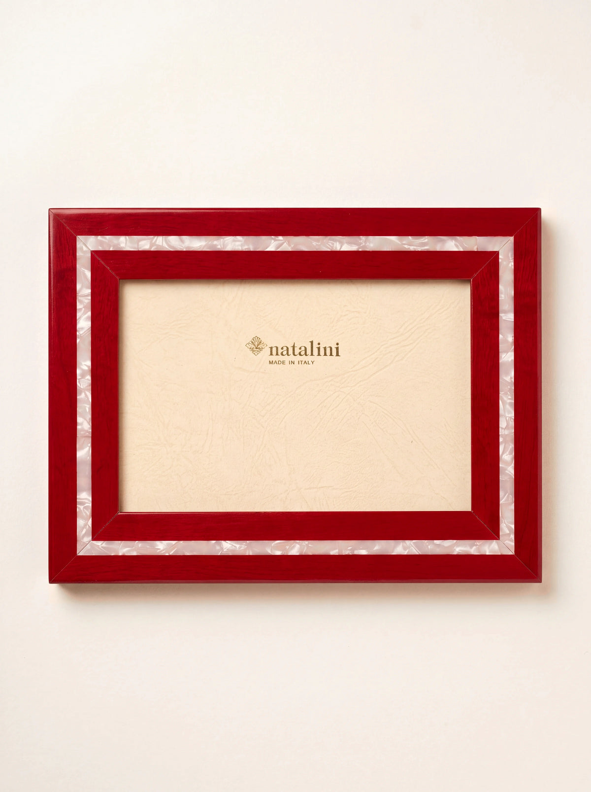 Glossy red wood veneer photo frame with an inlaid pearlescent band and natalini MADE IN ITALY insert