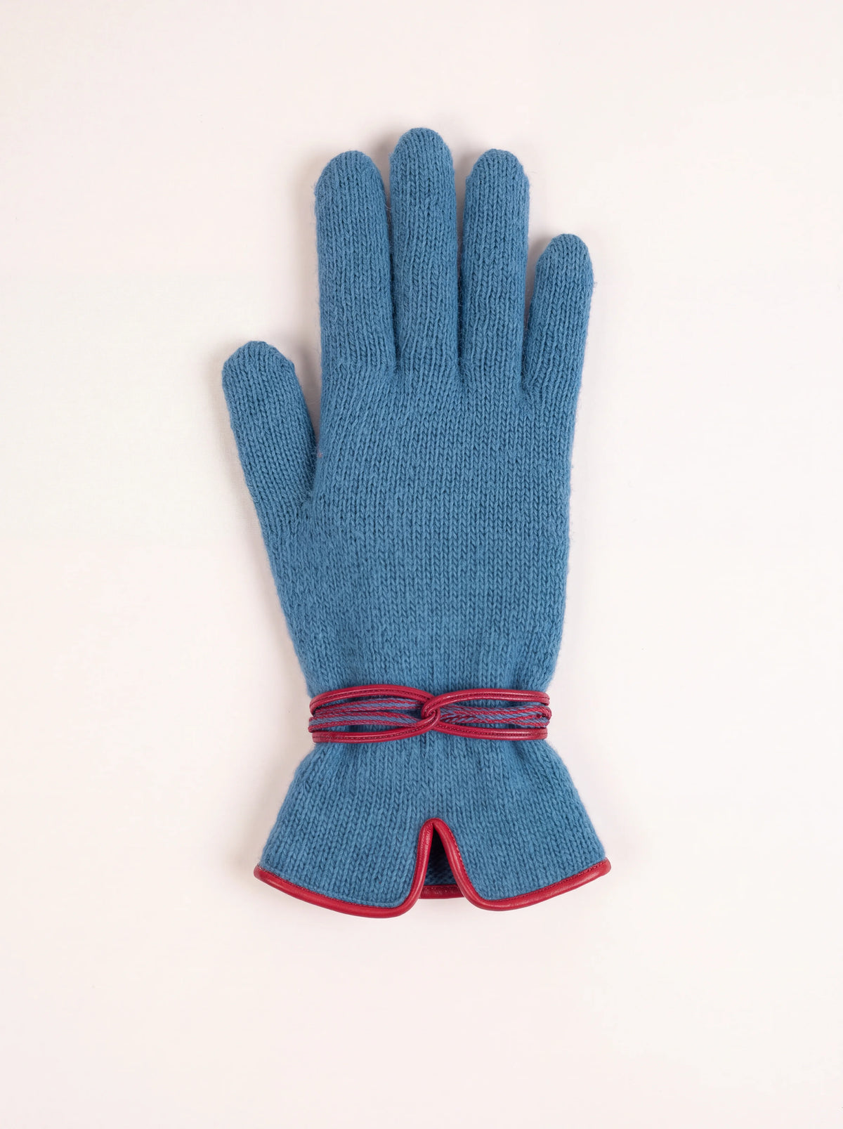 Petrol blue knitted wool and cashmere glove with red wrapped wrist cord and notched cuff with red trim