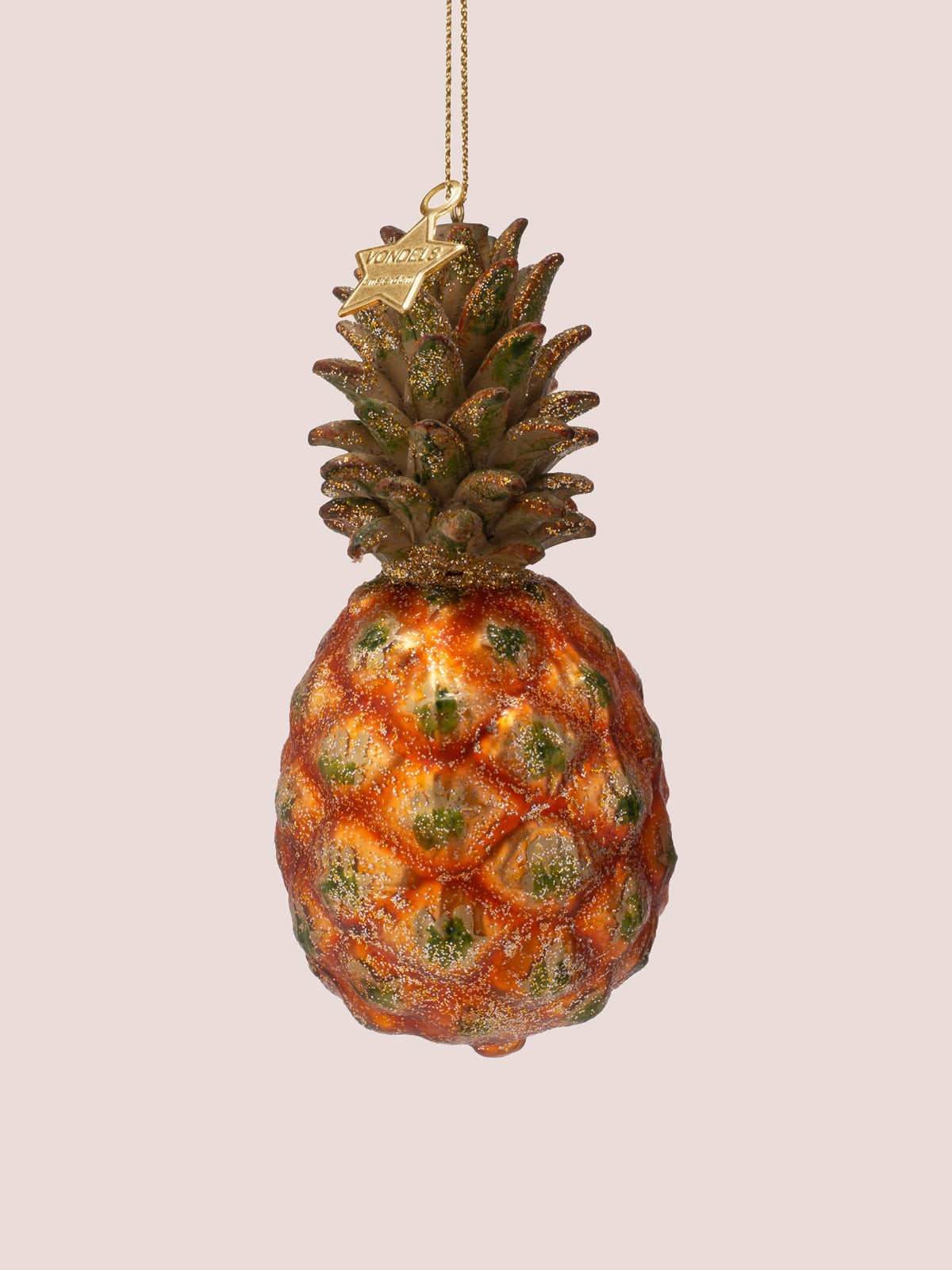 Side angle showing the leafy crown, gold hanging cord and star-shaped tag stamped with Vondels