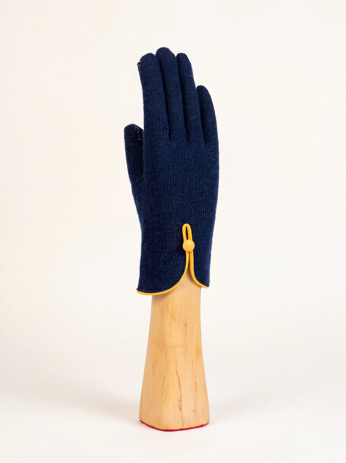 Navy knitted wool and cashmere glove with yellow trim and button closure at the cuff
