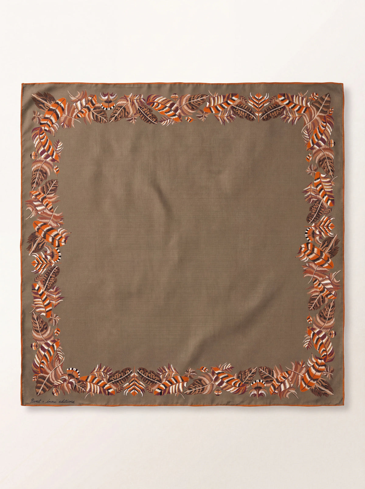 Square beige wool scarf laid flat, with a printed feather border and an orange rolled hem