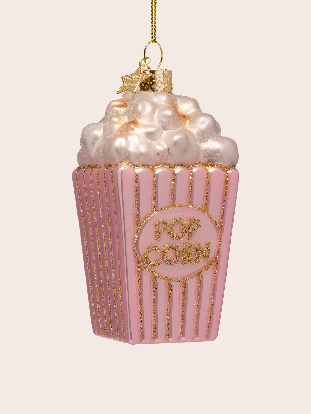 Three-quarter view showing the tapered popcorn box shape and pearlescent puffed popcorn