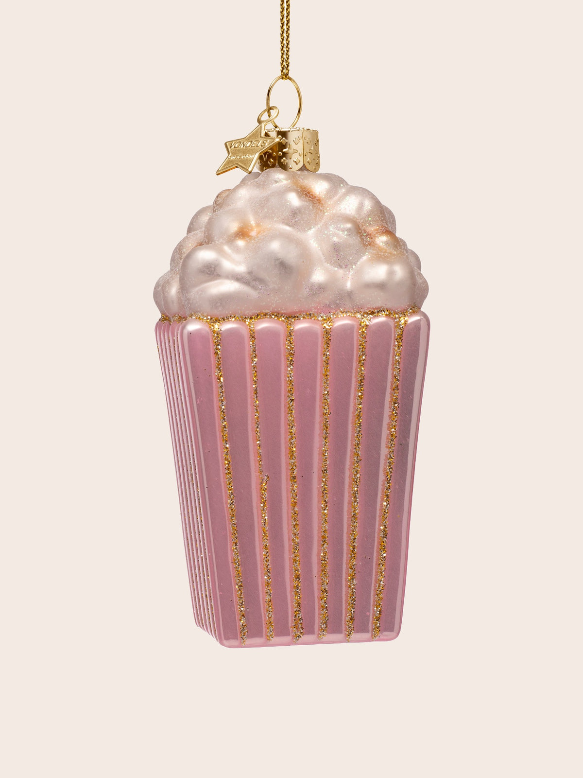Reverse view of the ornament showing the pink fluted sides with vertical gold glitter stripes