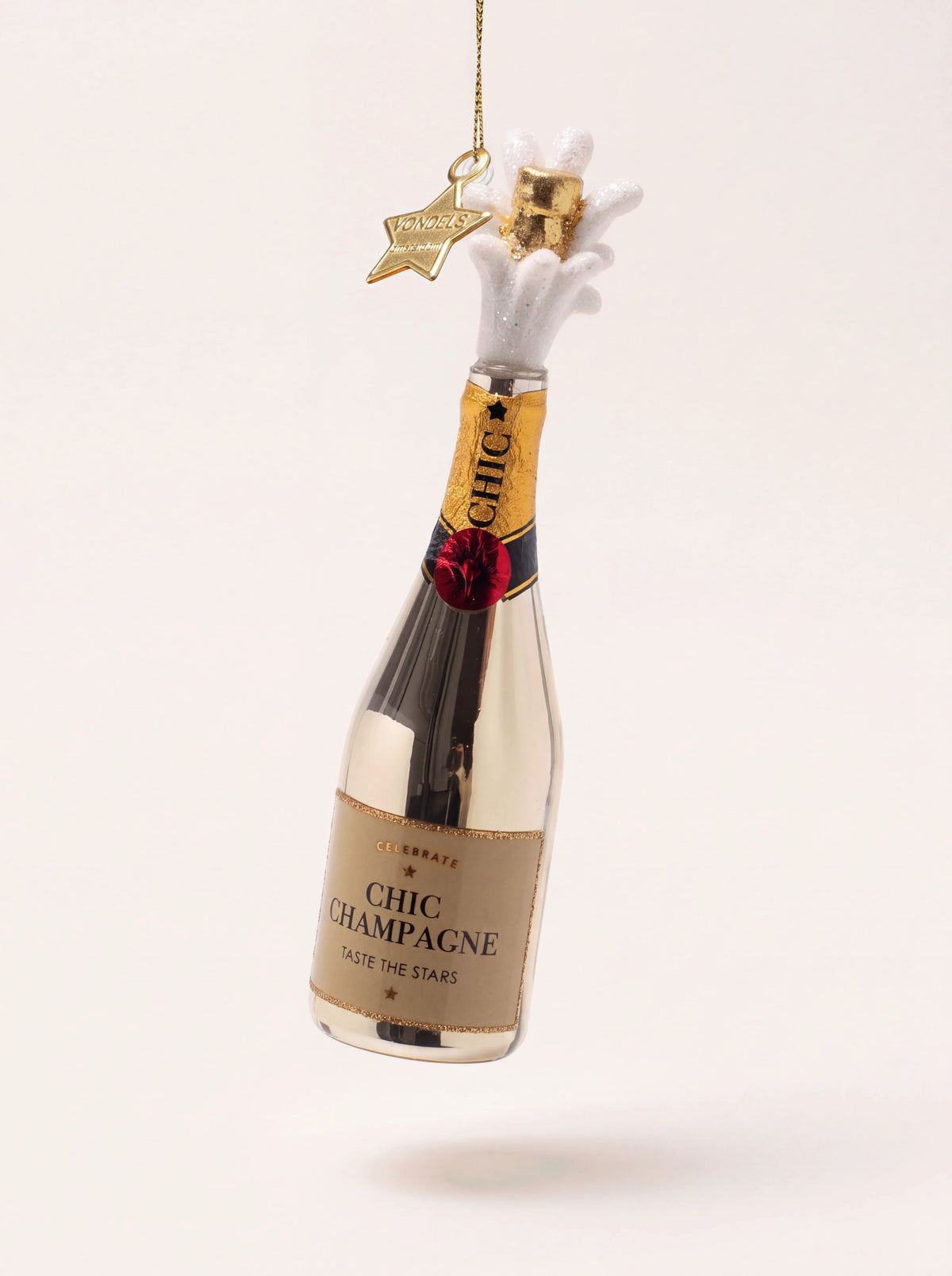 Glass champagne bottle ornament with a gold finish, popping cork in white glitter foam and Chic Champagne label
