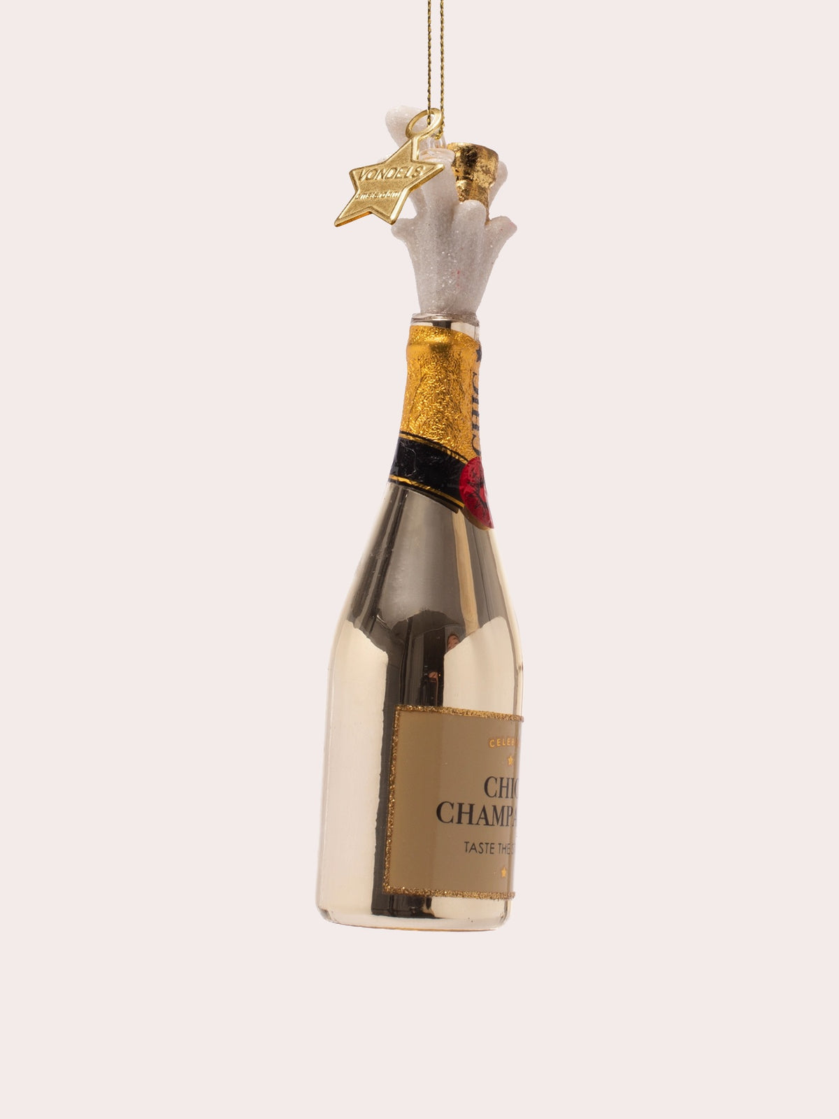 Three-quarter view of the glass ornament showing the textured gold neck foil and glitter foam spray