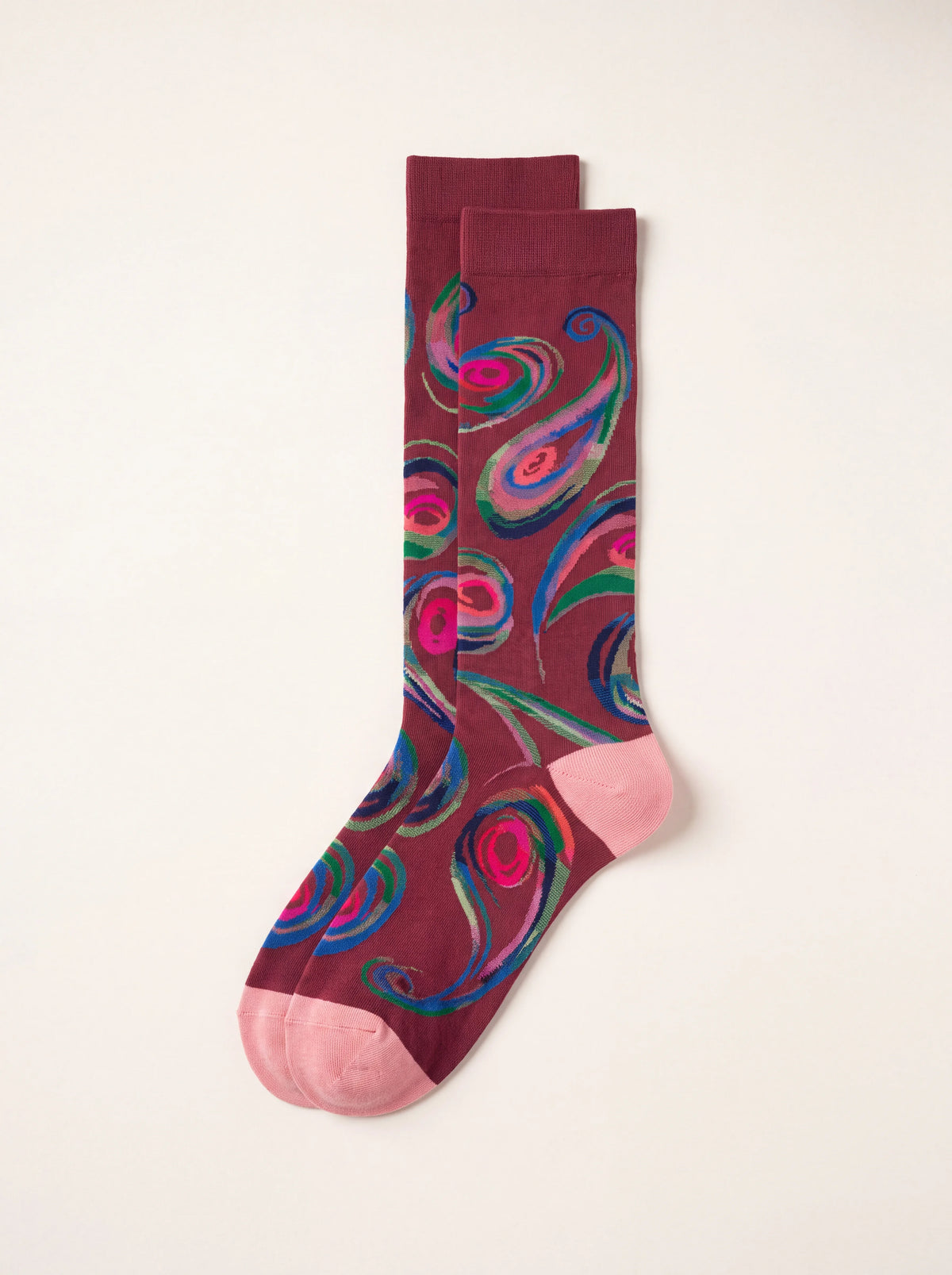 Burgundy cotton knee-high socks with a multicoloured paisley pattern, pink heels, and toes
