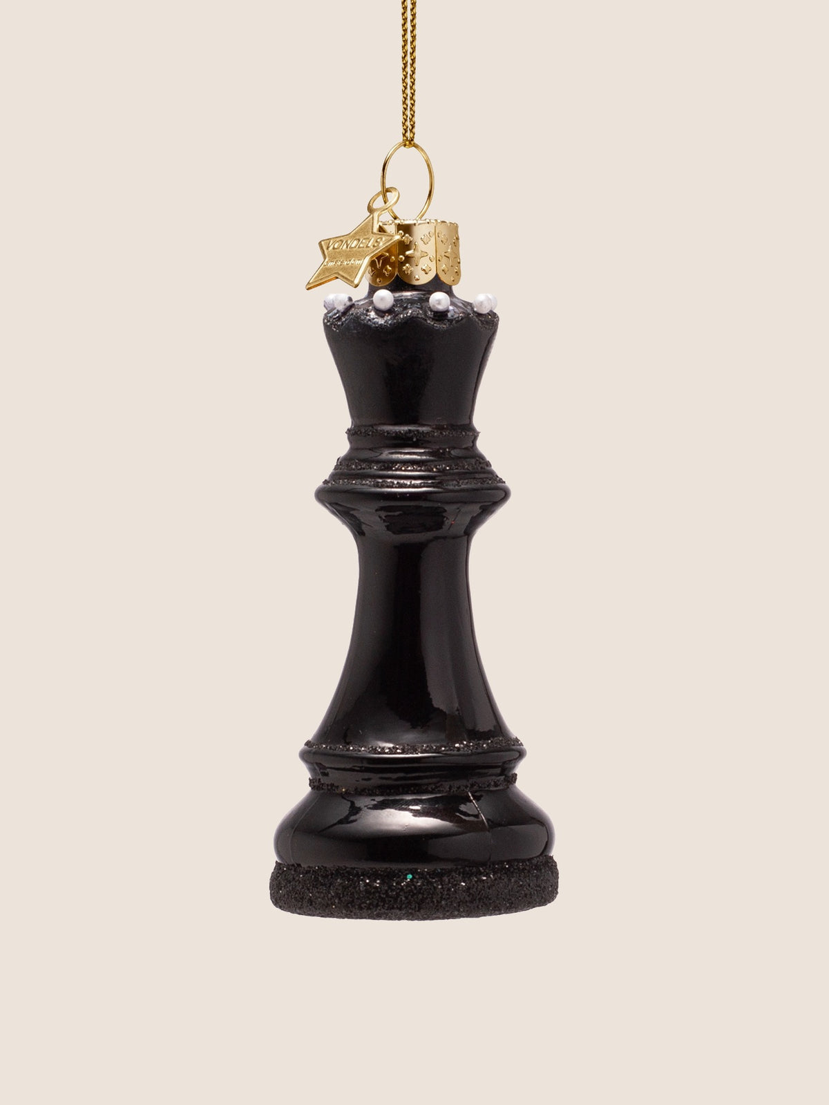 Queen chess piece ornament showing the white pearl-beaded crown rim and black glittered base