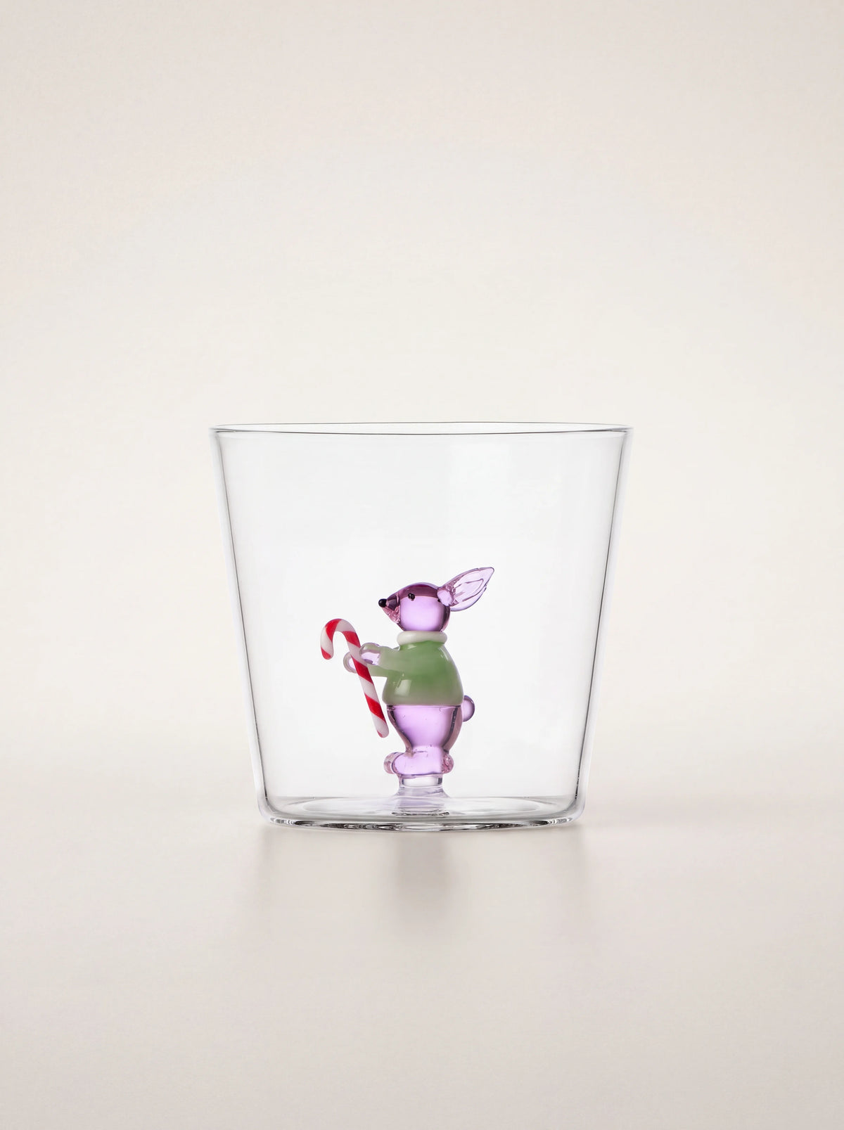 Clear borosilicate glass tumbler with an integrated pink rabbit figurine holding a candy cane