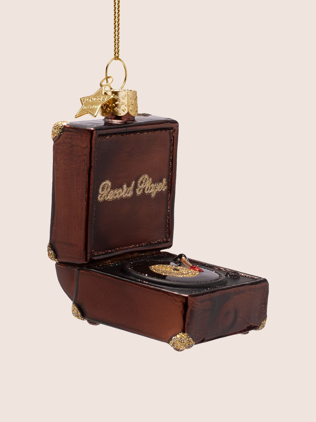 Three-quarter view of the record player ornament showing the turntable deck and corner glitter details