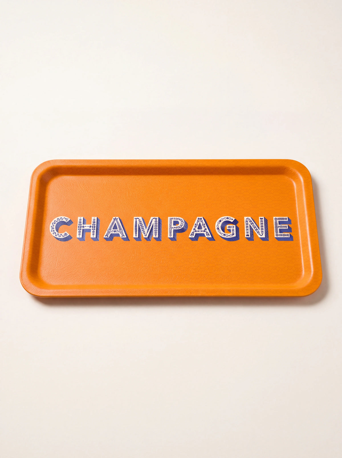 Rectangular orange tray with rounded corners and CHAMPAGNE printed in decorative blue and white lettering