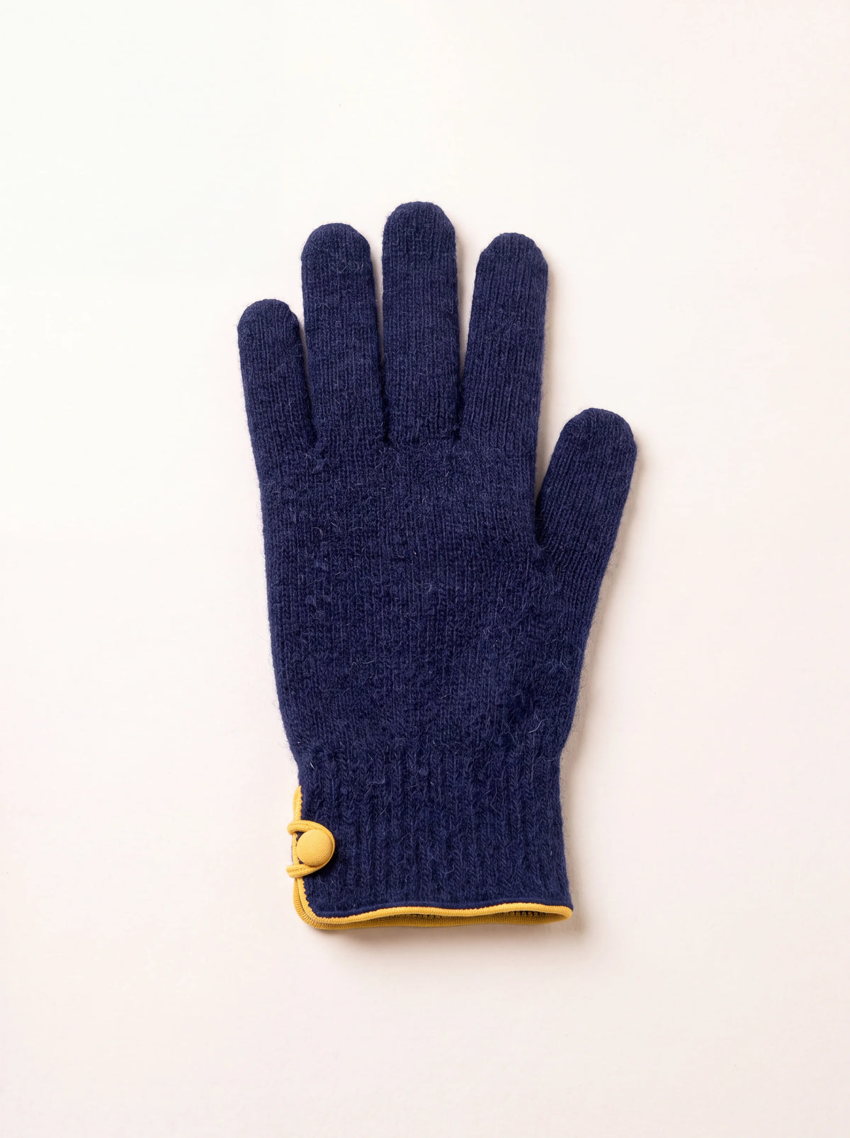 Navy wool and cashmere knit glove with a ribbed cuff, yellow trim and covered button at the wrist