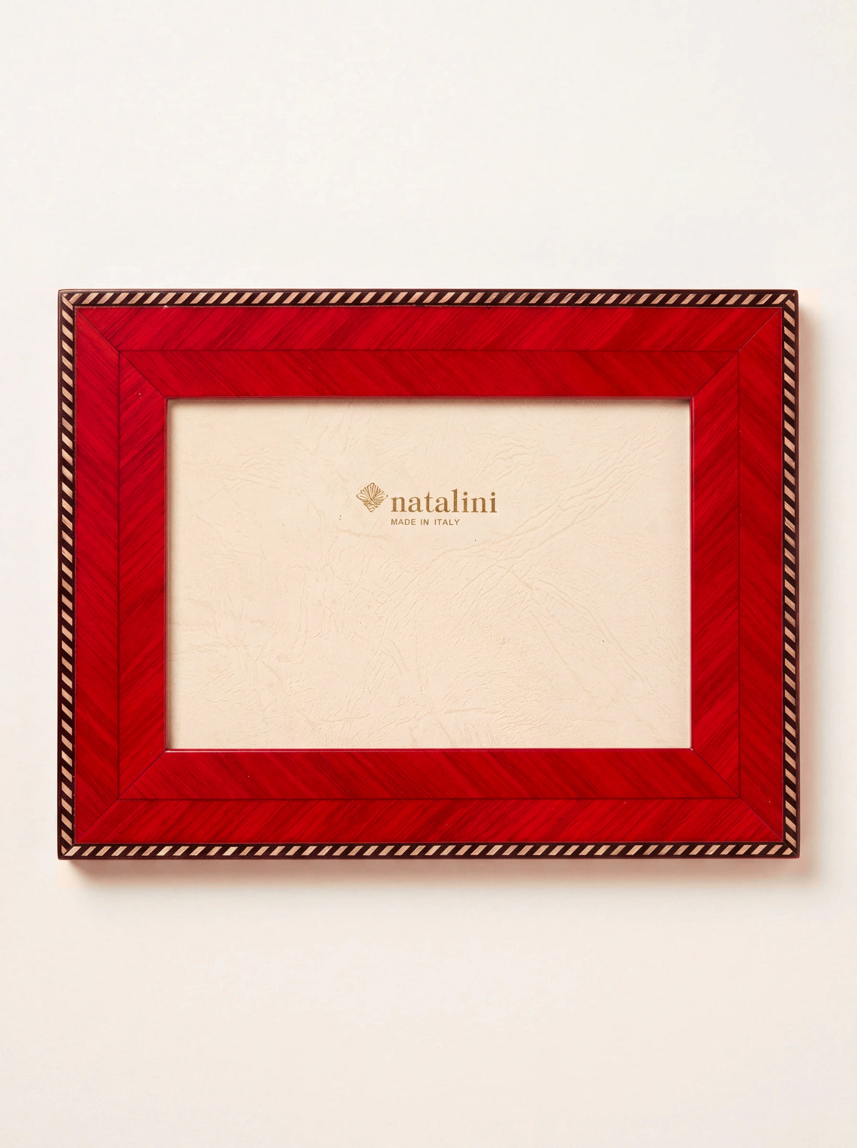 Red inlaid wood veneer photo frame with a striped rope border and cream insert reading natalini MADE IN ITALY