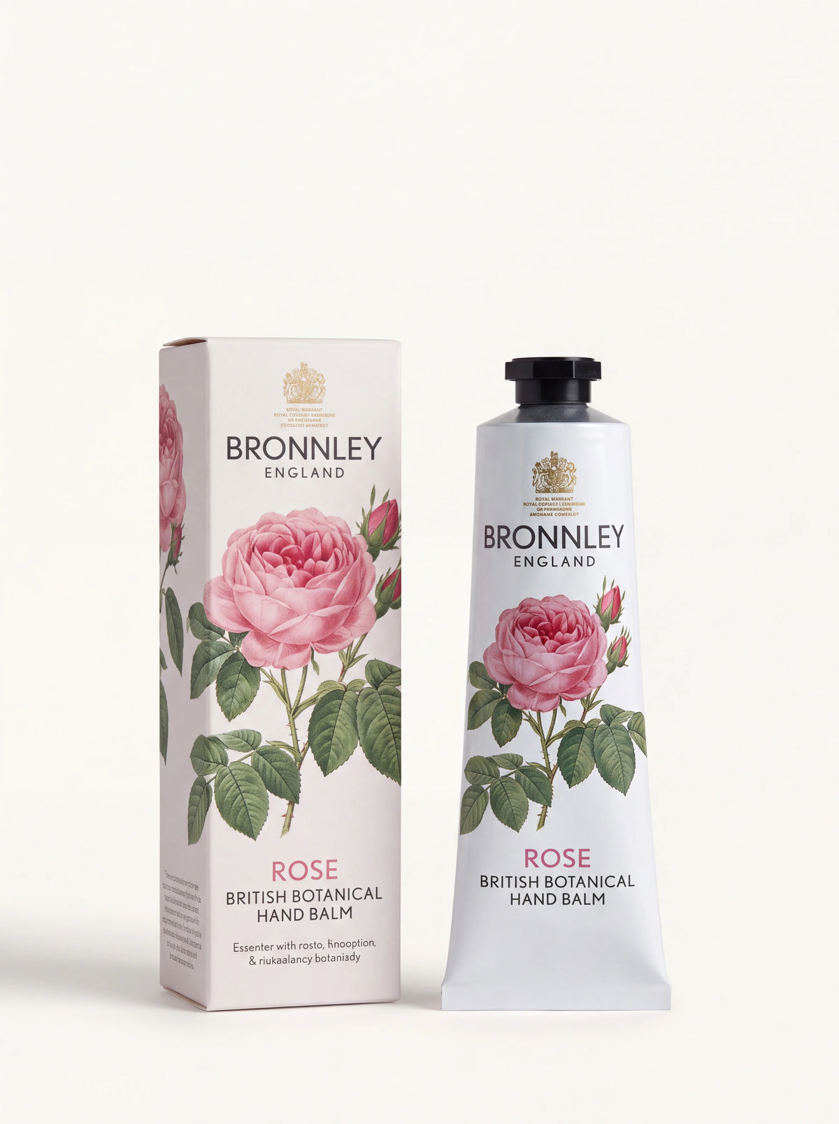 Rose hand balm in a white aluminium tube beside its matching box with botanical pink rose illustrations
