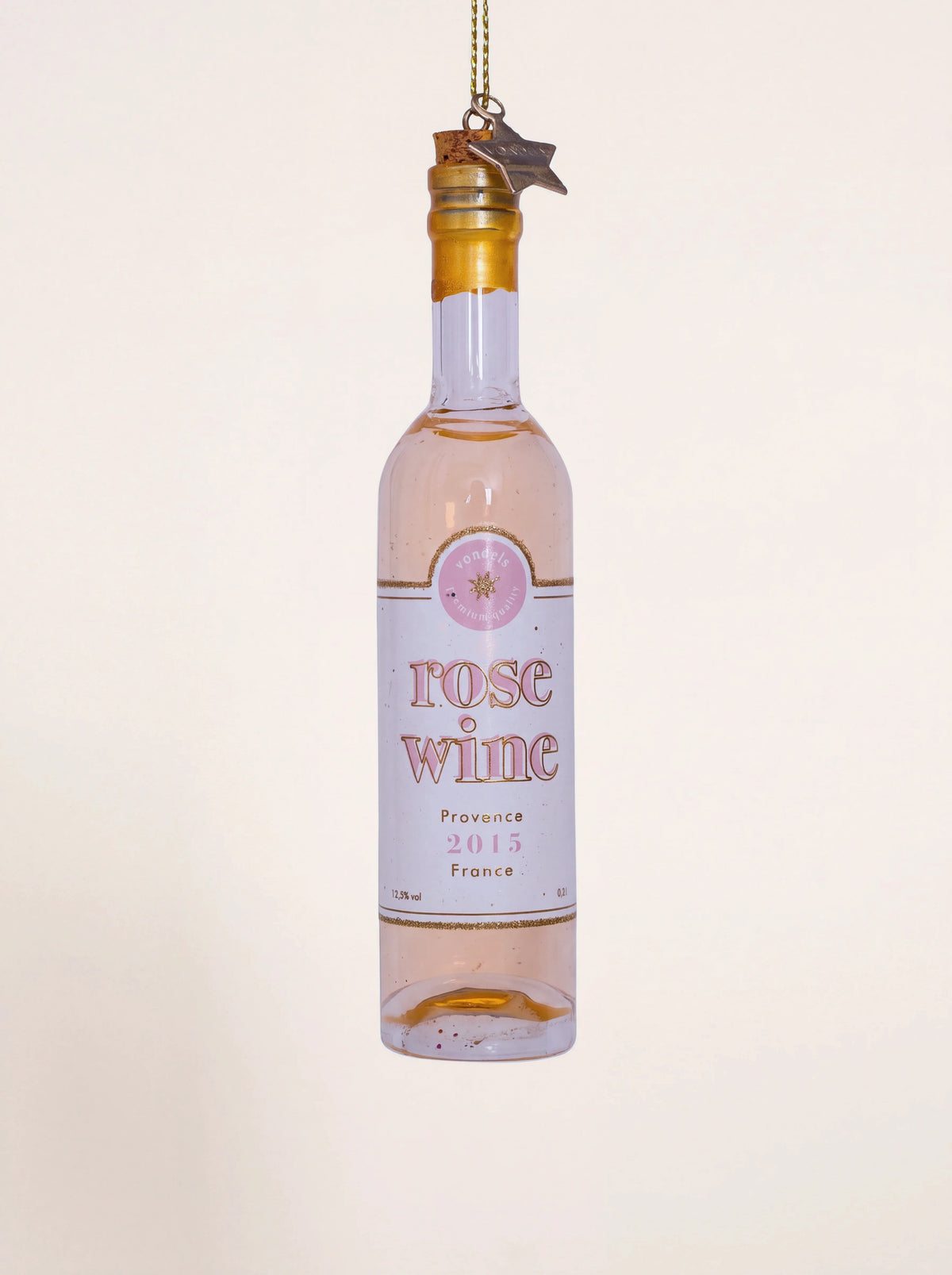 Glass rosé wine bottle ornament with a gold neck, cork stopper, and label reading rose wine Provence