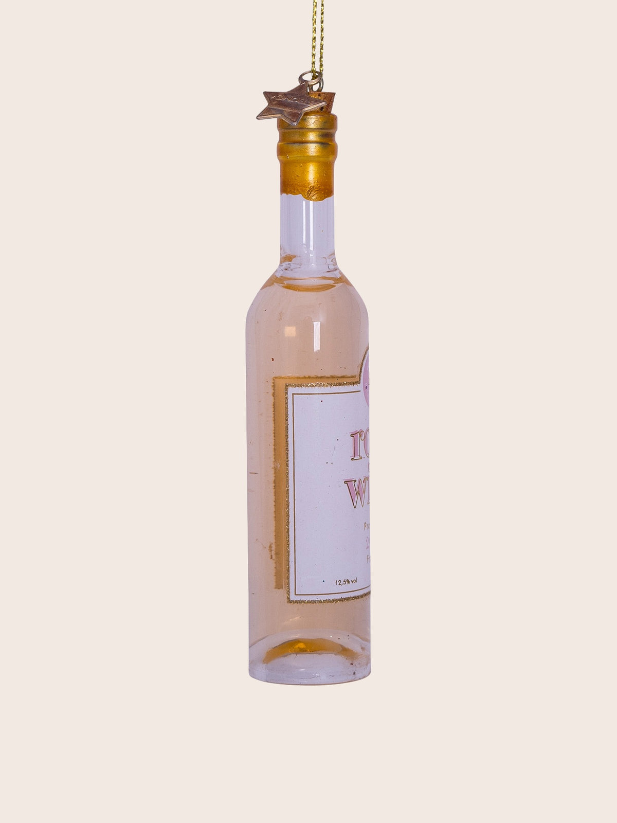Side view of the glass rosé wine bottle ornament showing the glitter trim on the label and hanging cord