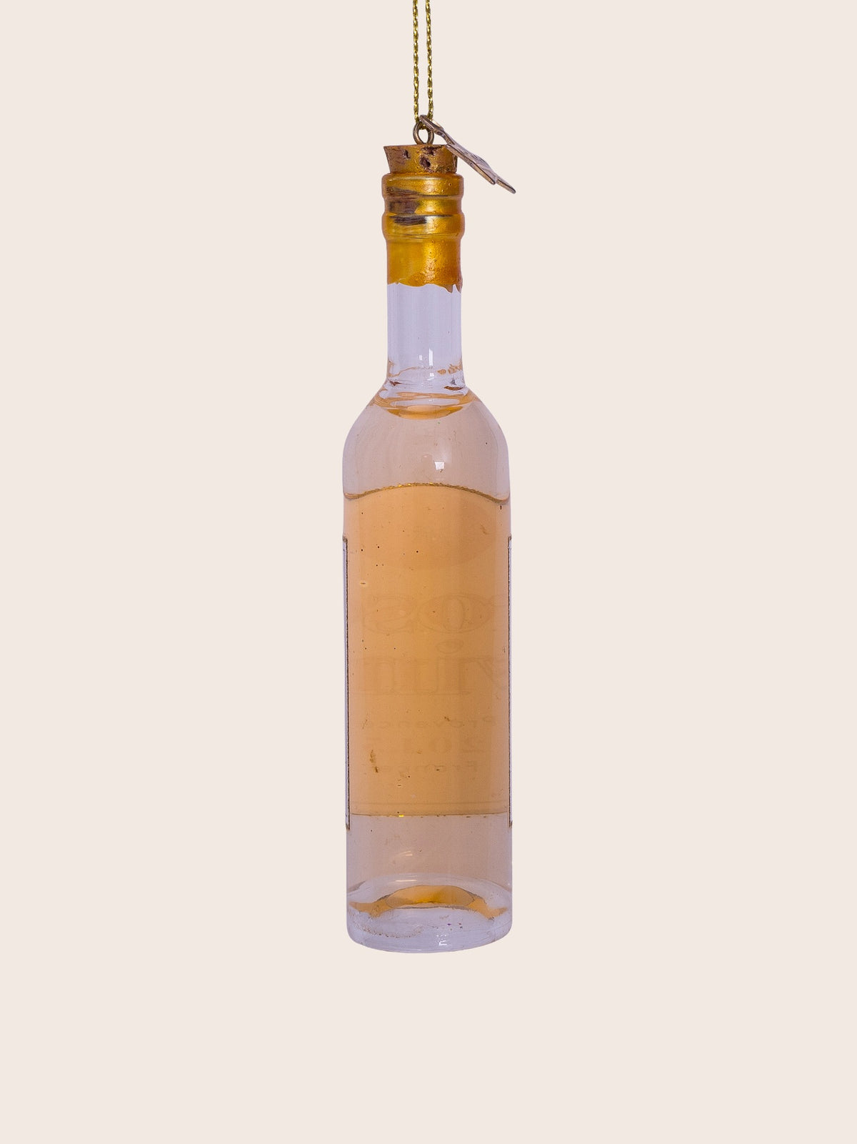 Rear view of the translucent pale pink glass rosé wine bottle ornament with gold neck and base accents
