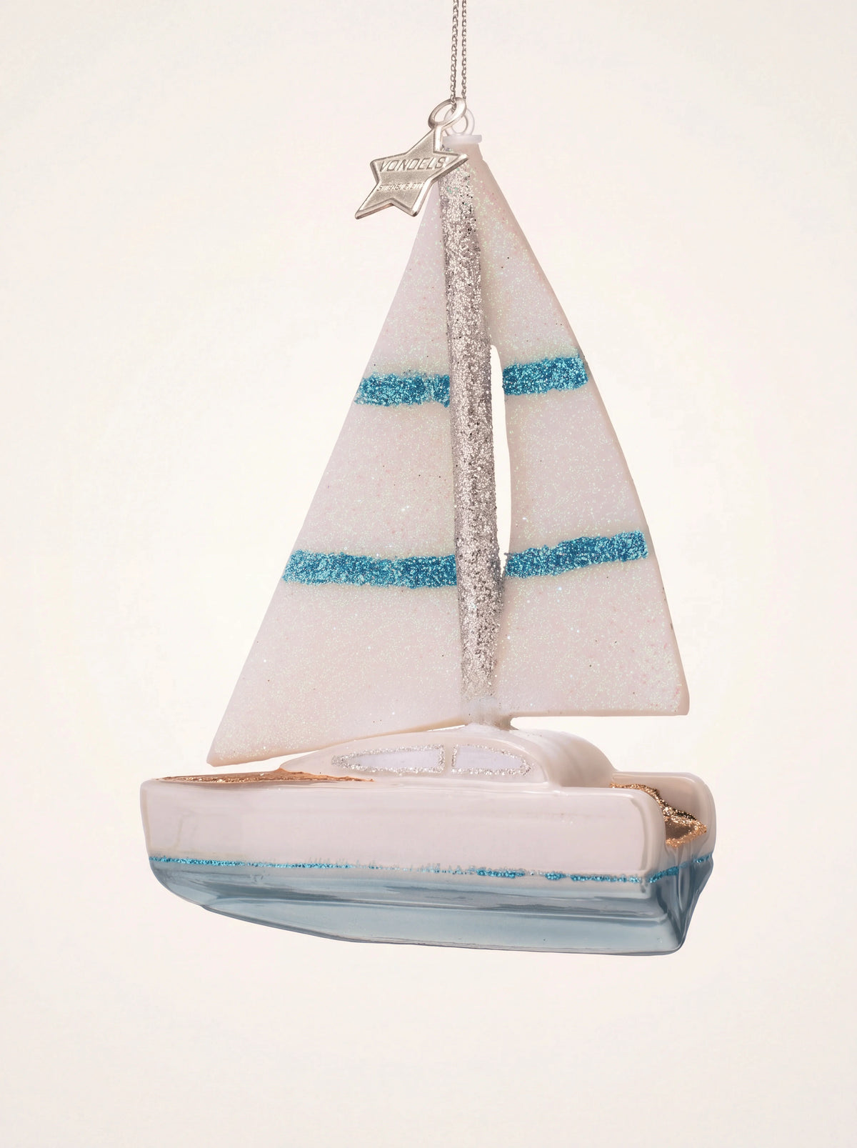 Glass sailing boat ornament with opal-white sails, blue glitter stripes and a light blue hull