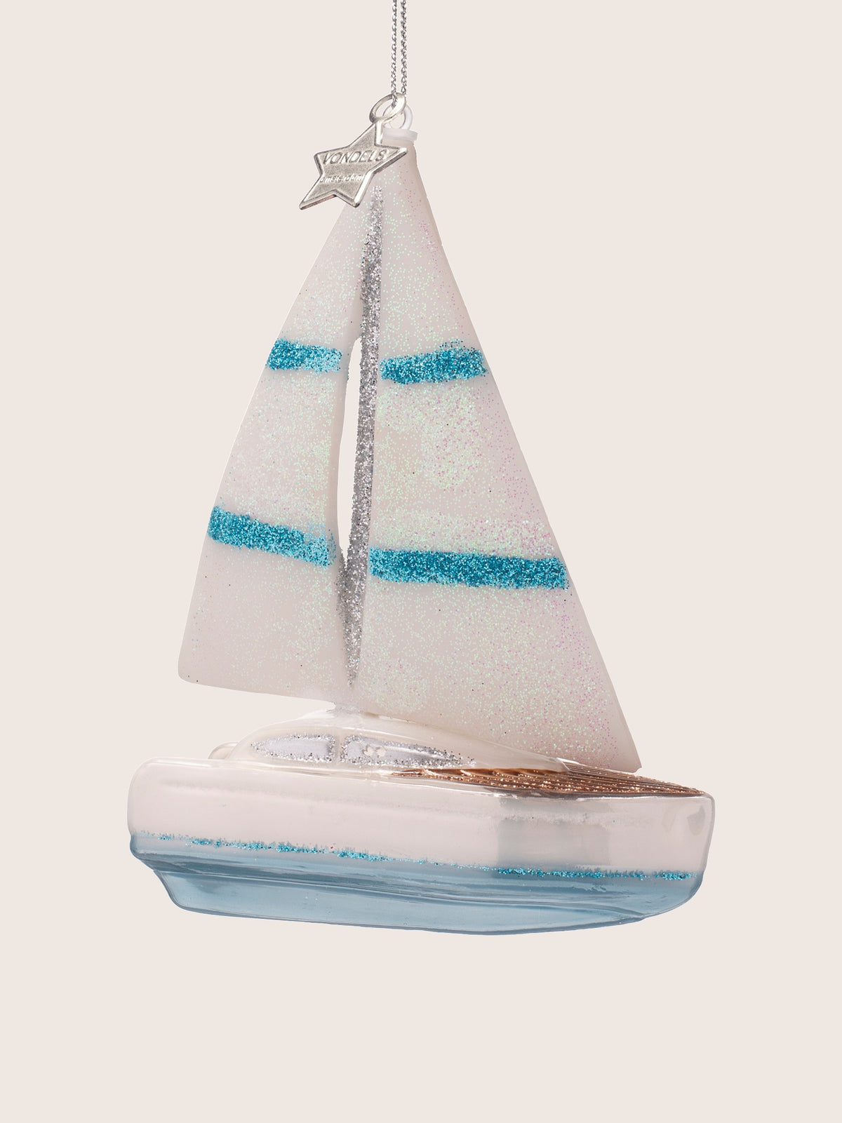 Glass sailing boat ornament angled to show the bronze-glitter foredeck and cabin windows