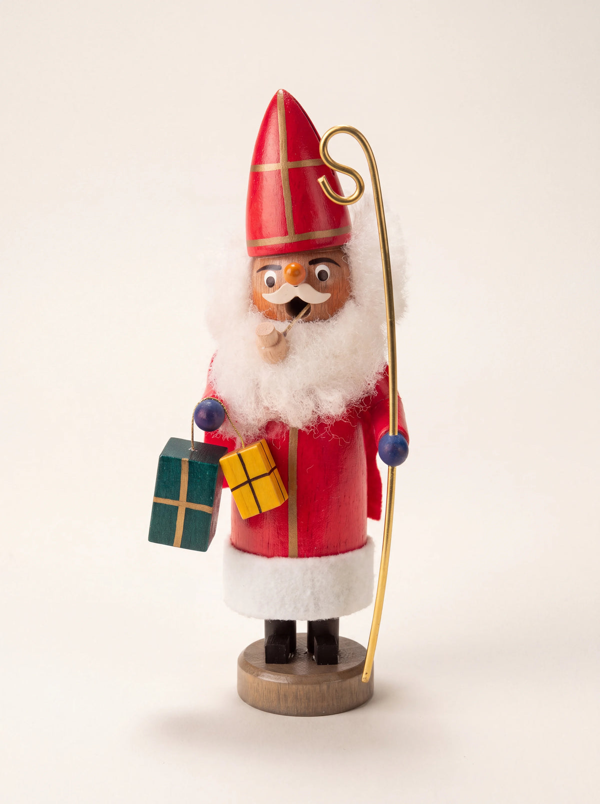 Painted wooden Saint Nicholas incense smoker with red mitre, pipe, golden crosier and two gifts