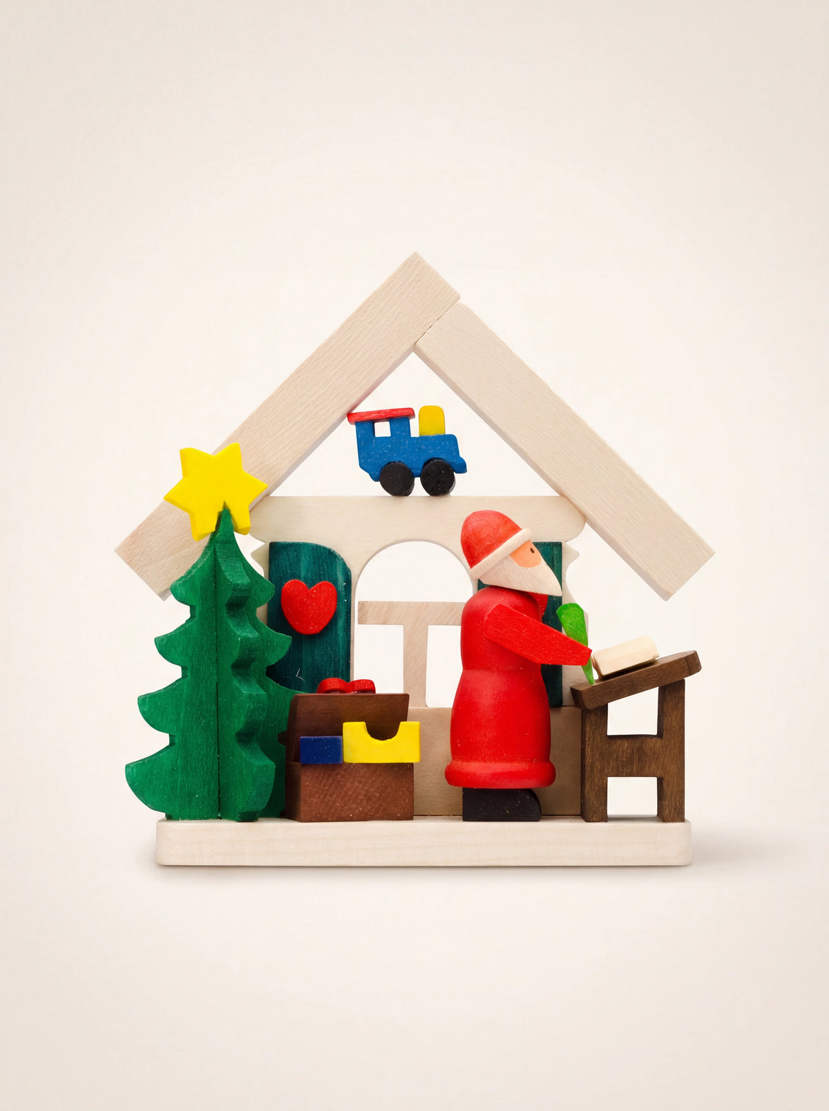 House-shaped maple wood ornament with Santa Claus reading a wish list, a Christmas tree and small toys
