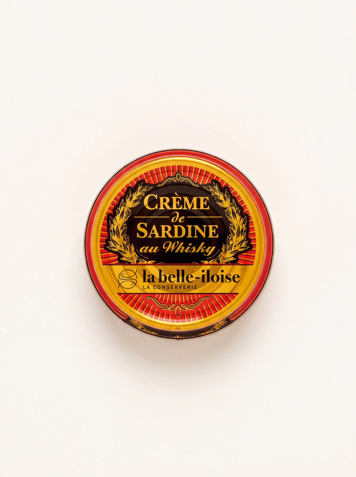 Round tin of sardine cream with whisky, labelled Crème de Sardine au Whisky in red and gold