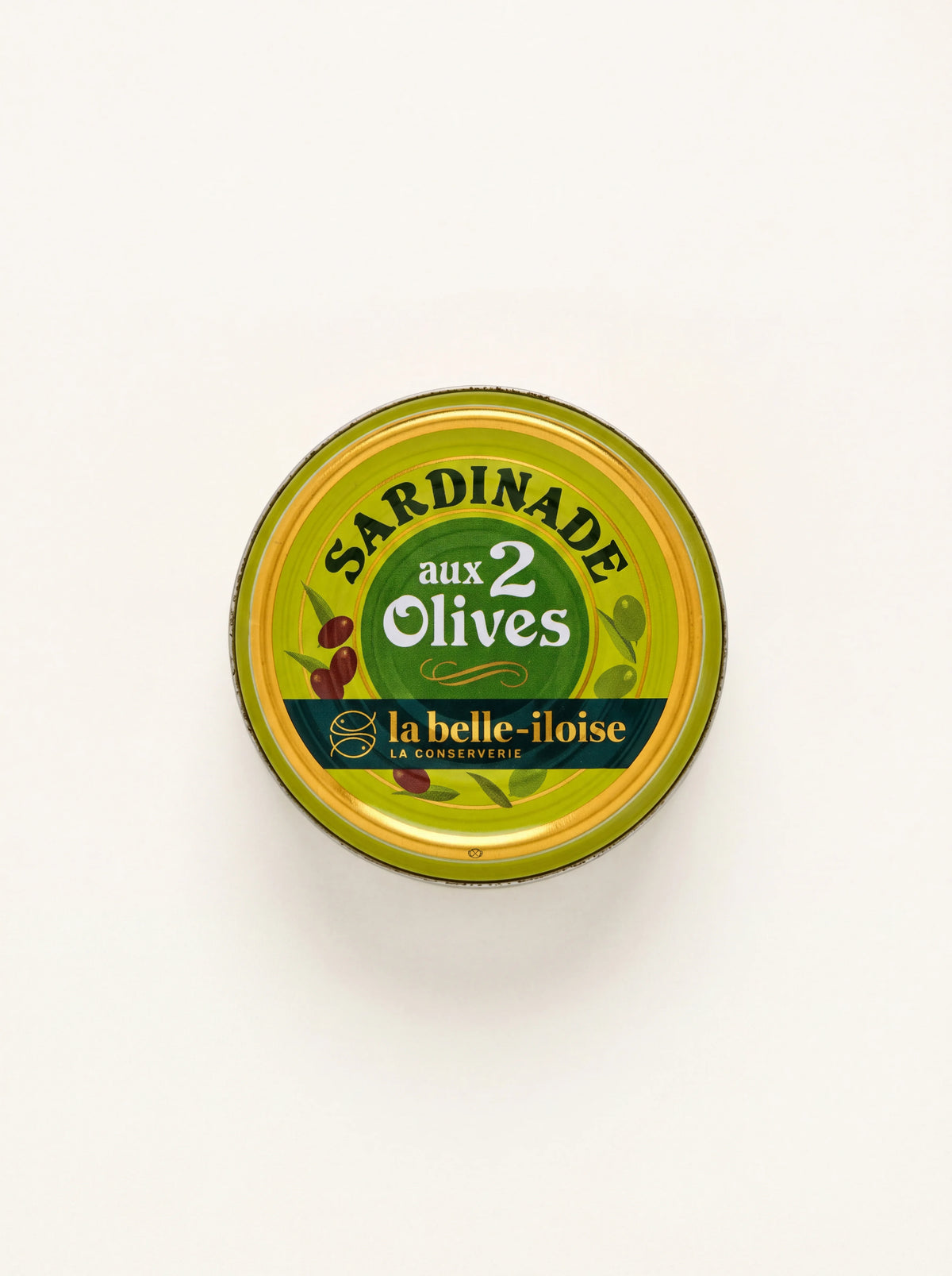 Round tin of sardine spread, top view showing the yellow and green lid labelled Sardinade aux 2 Olives
