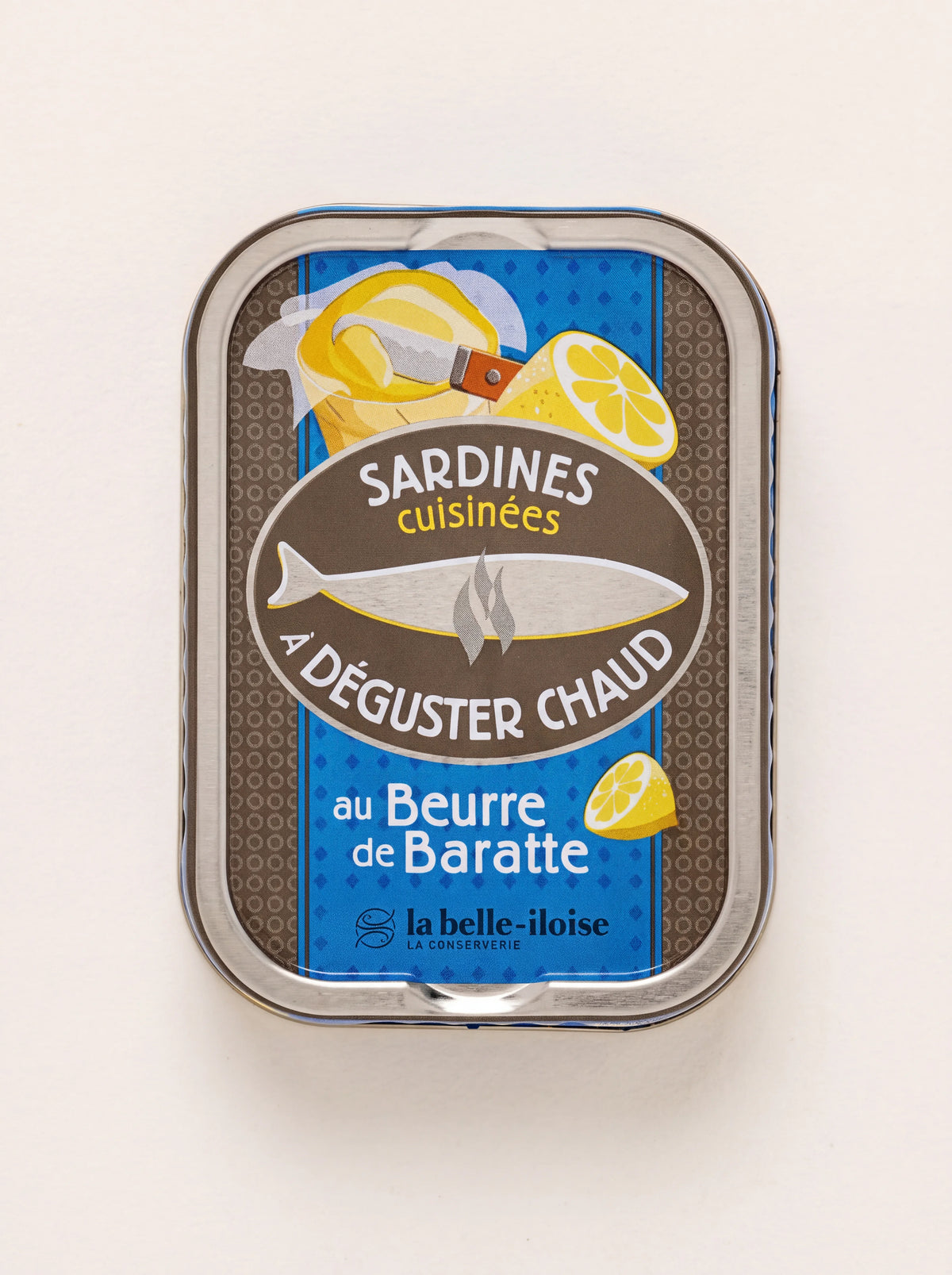 Tin of sardines with churned butter and lemon, showing the blue and brown top label