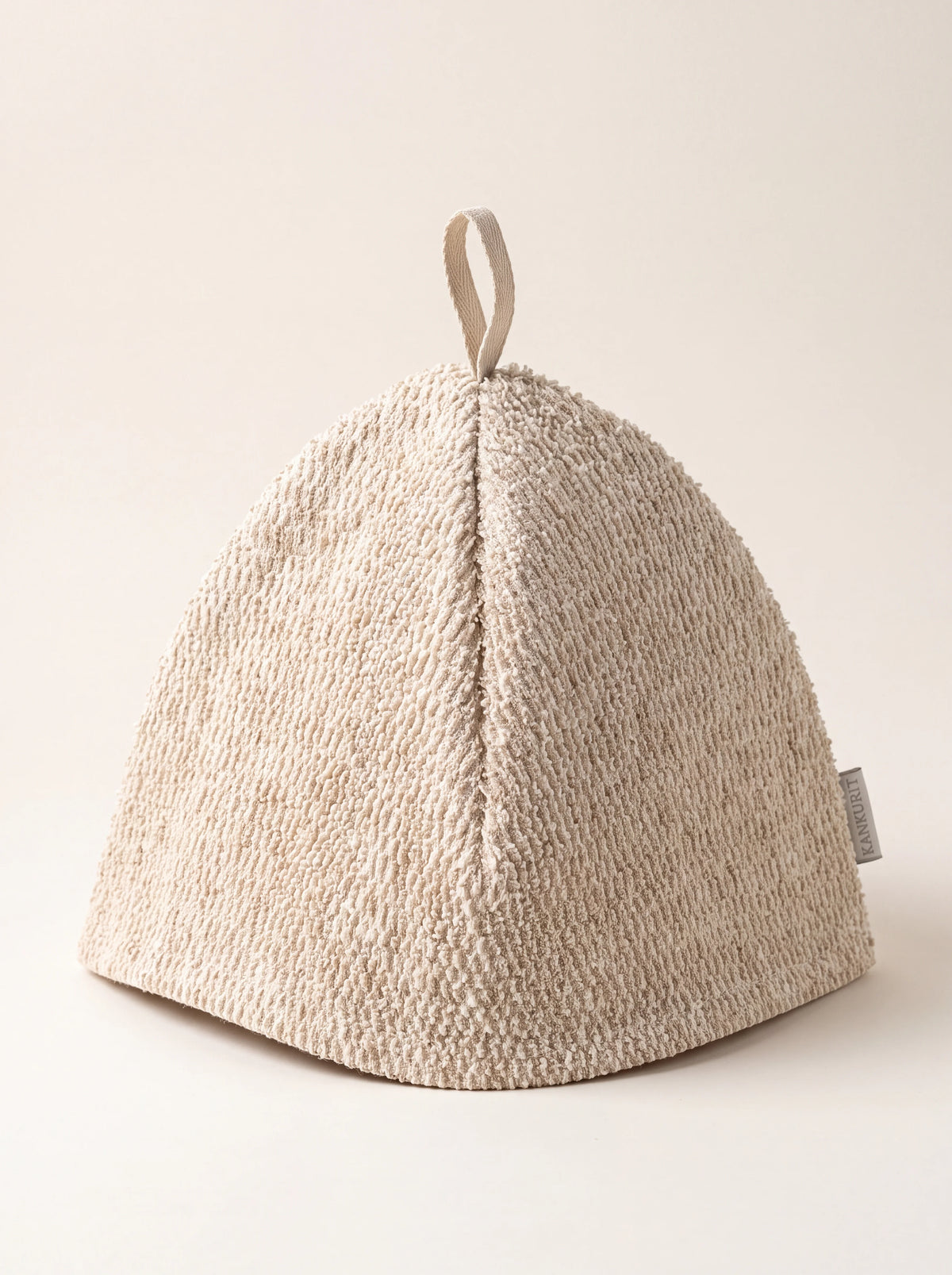 Textured linen terry sauna hat in natural white with a panelled dome and top hanging loop