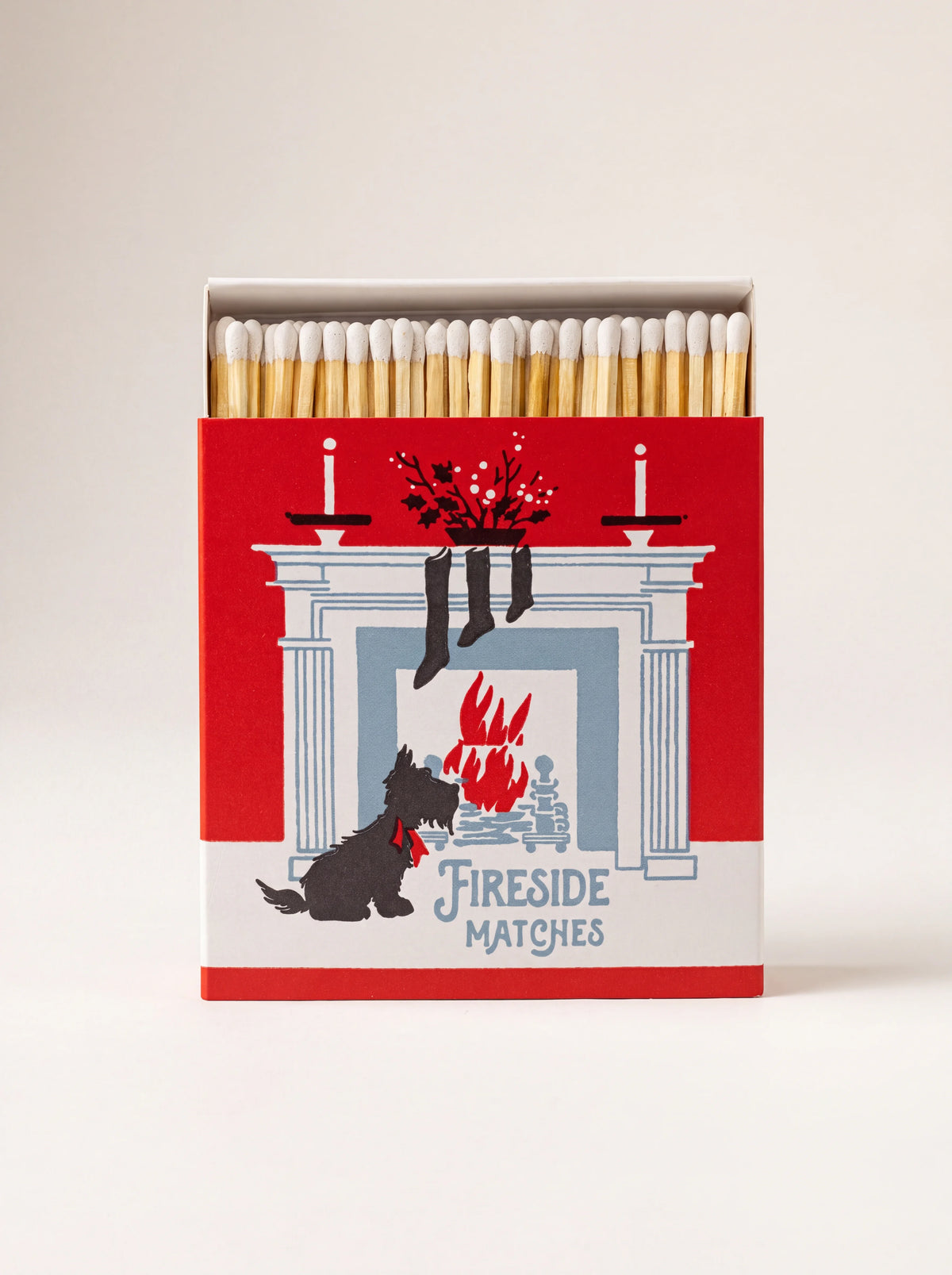 Matchbox with white-tipped matches, illustrated with a Scottish terrier by a fireplace and text 'FIRESIDE MATCHES