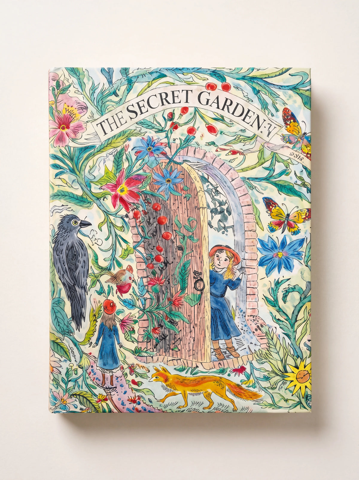 Secret Garden jigsaw puzzle box with an illustrated scene of an arched garden doorway, birds, and a fox
