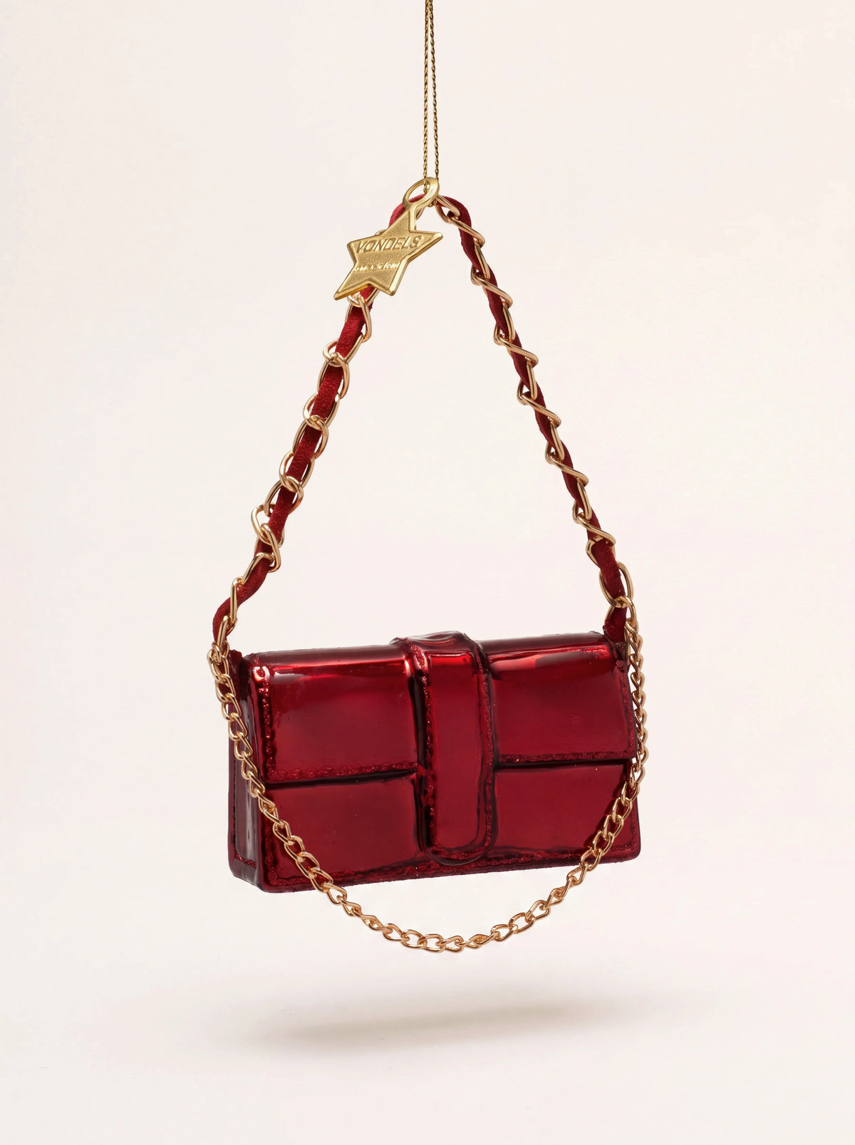 Glossy burgundy glass shoulder bag Christmas ornament with intertwined chain strap and gold star charm