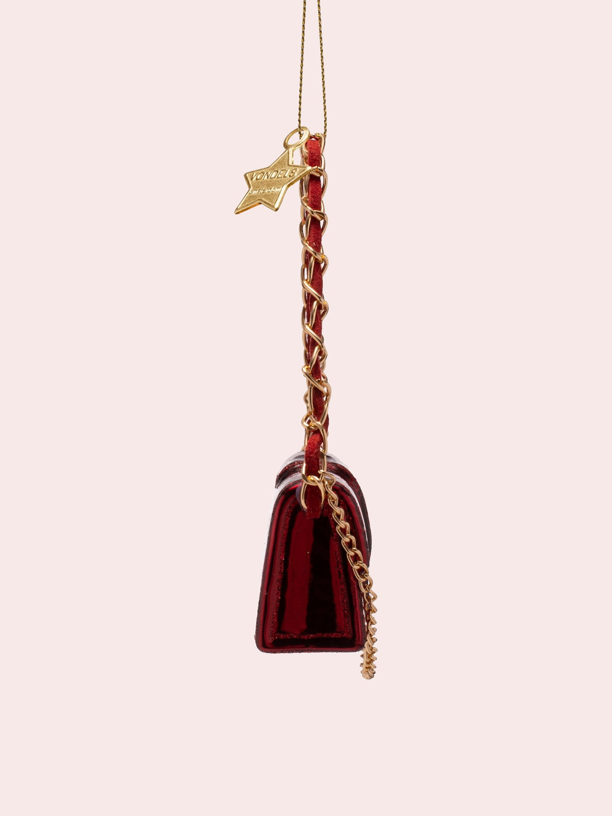 Side profile of the burgundy glass ornament showing the tapered depth and chain strap