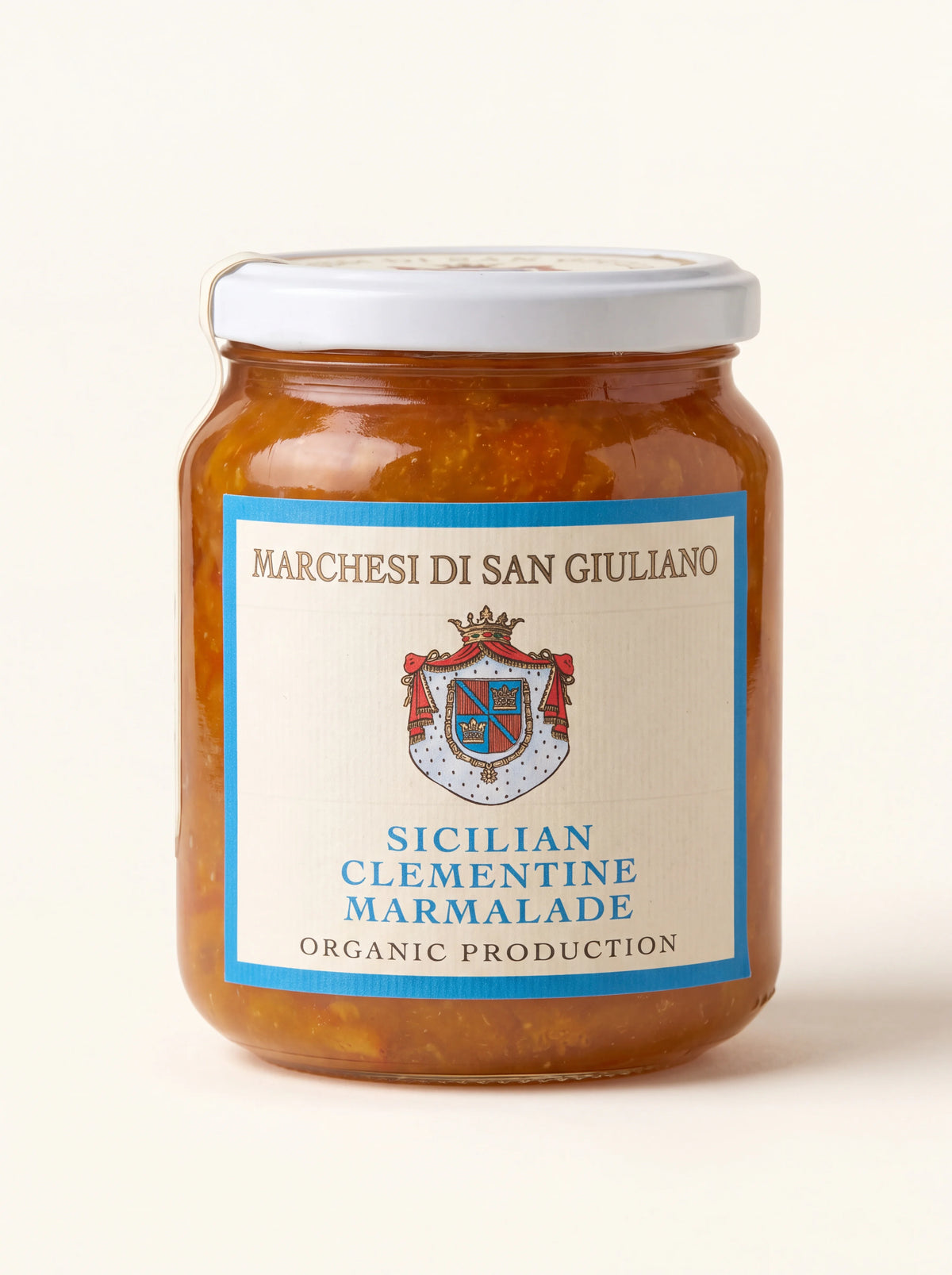 Sicilian clementine marmalade in a glass jar with a white screw-top lid