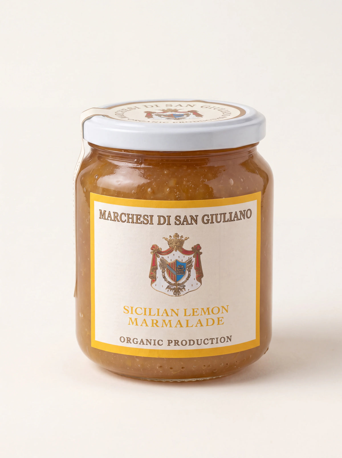Sicilian lemon marmalade in a glass jar with white lid, labelled Marchesi di San Giuliano