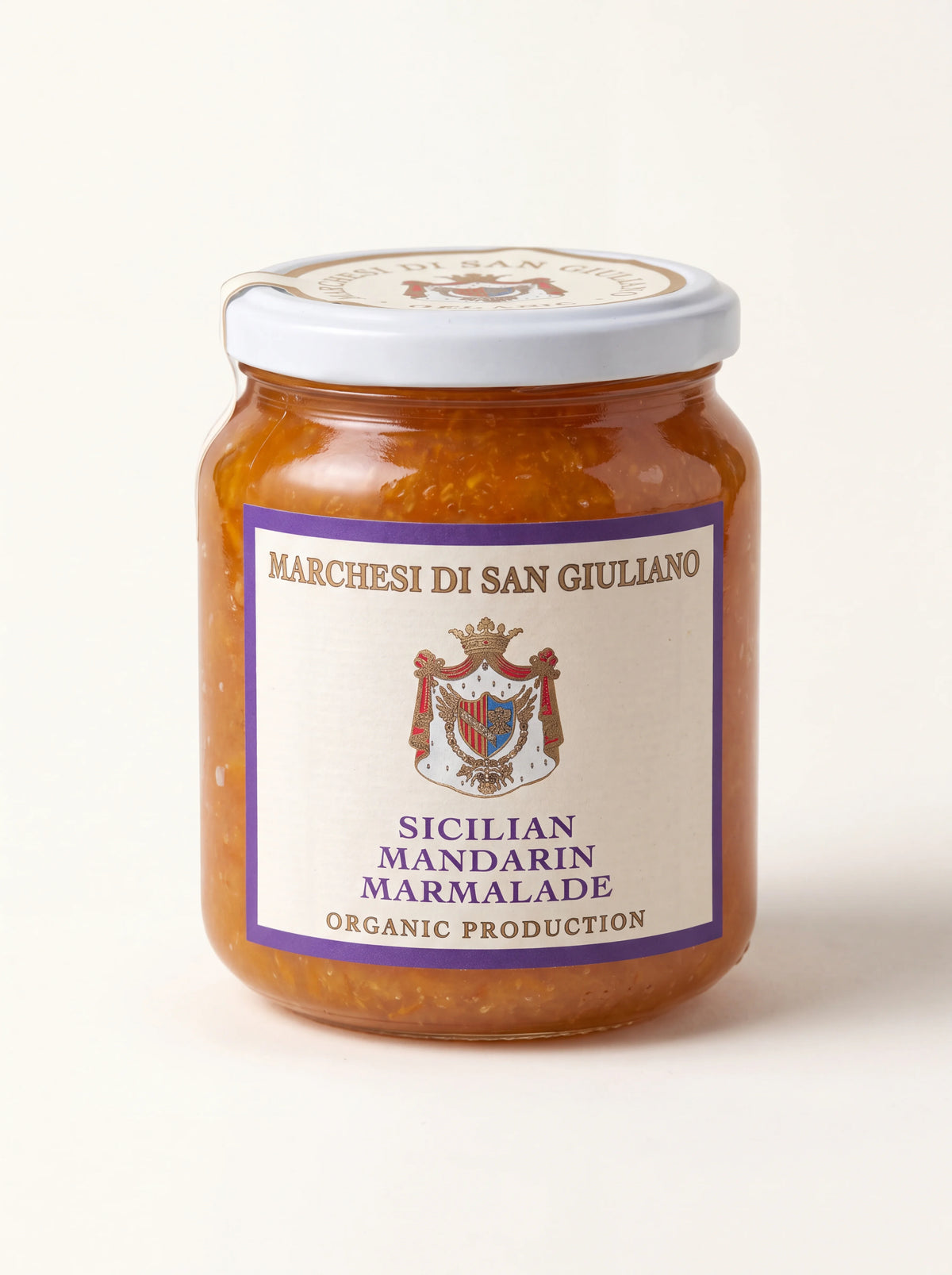 Sicilian mandarin marmalade in a clear glass jar with a white screw-top lid and crest label