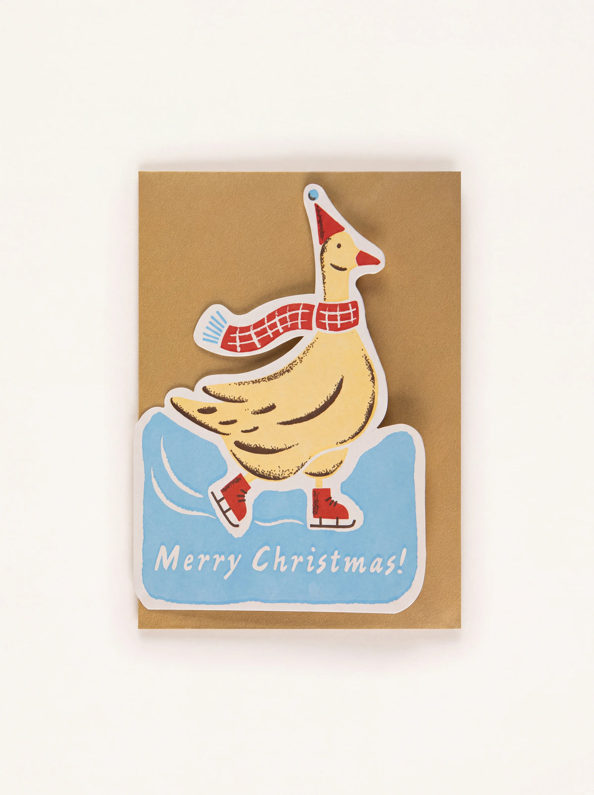 Christmas card shaped like an ice-skating goose in a red scarf and hat, with the words Merry Christmas!