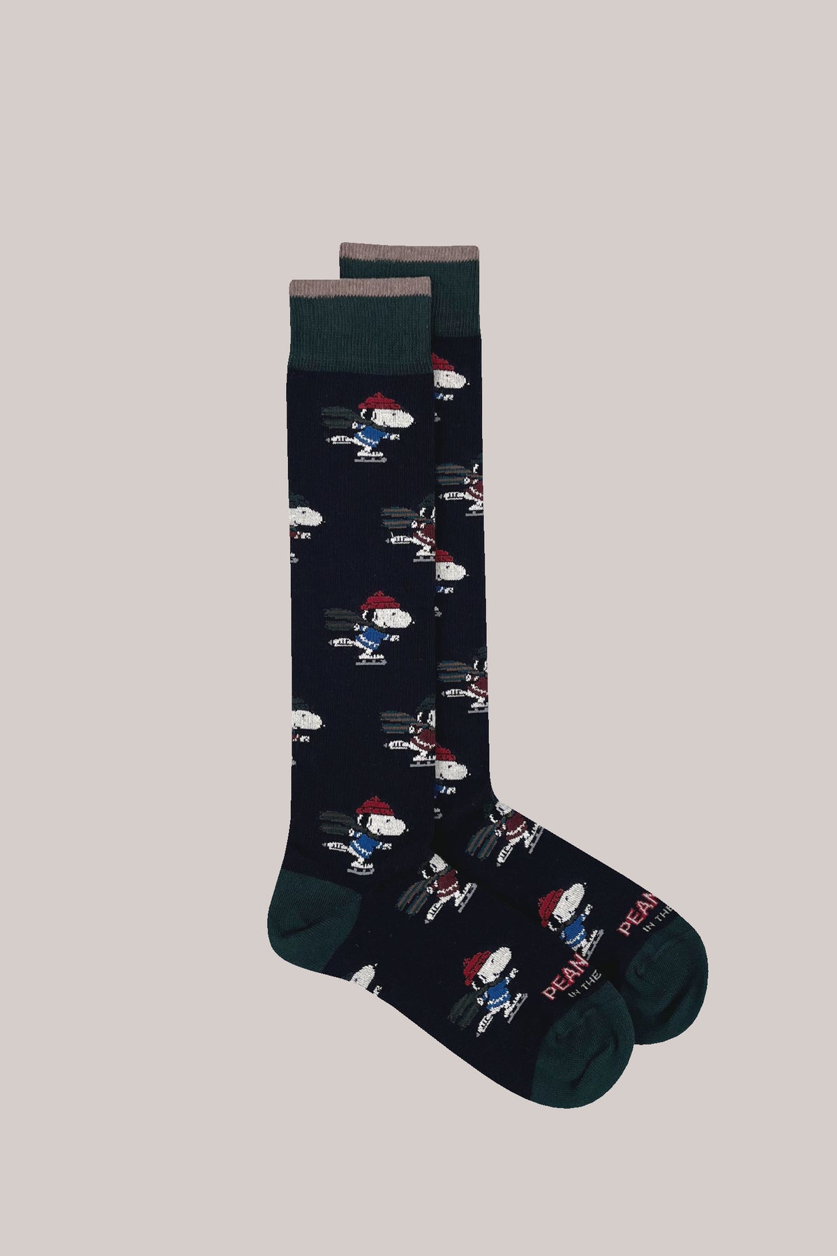 Dark blue cotton socks with ice-skating Snoopy motif, contrasting green ribbed cuffs, heels and toes