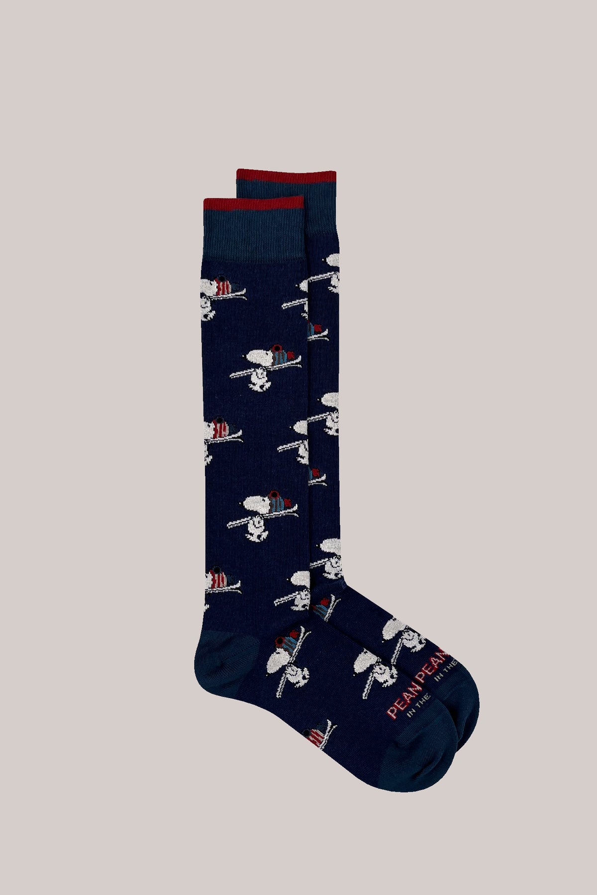 Dark blue cotton-blend socks with all-over Snoopy ski pattern and red-tipped ribbed cuffs