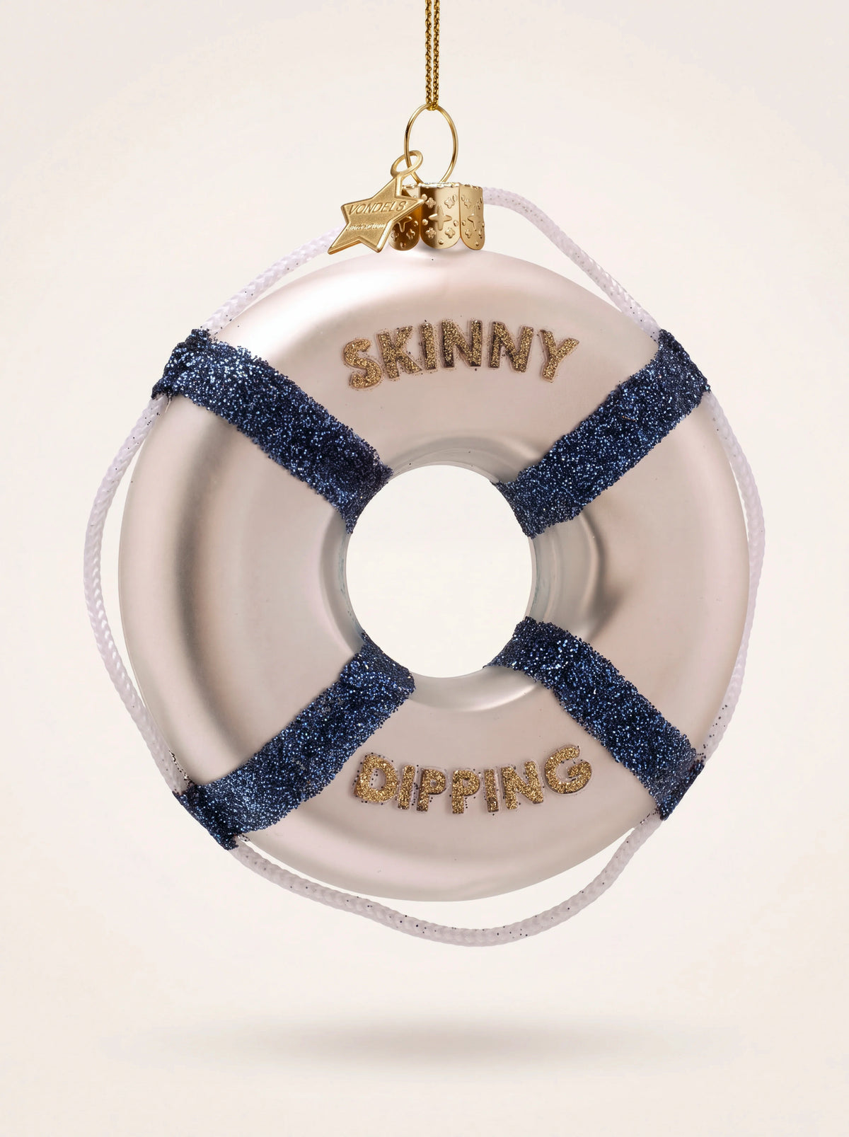Glass lifebuoy ornament with blue glitter stripes, white cord and gold lettering reading 'Skinny Dipping