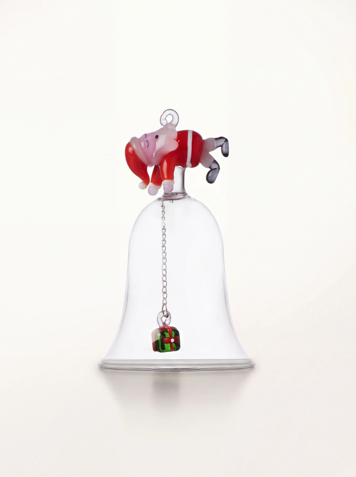 Clear borosilicate glass bell topped with a sleeping Santa and a gift-shaped clapper on a metal chain