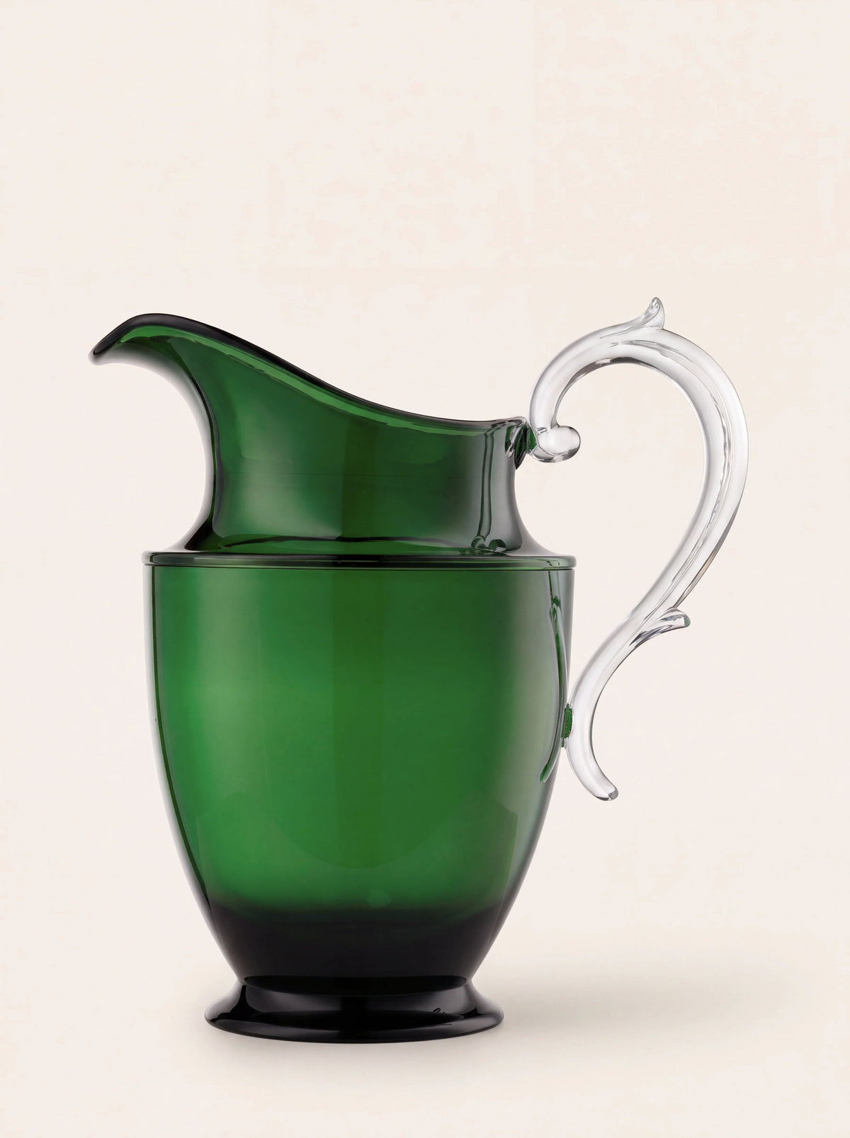 Green acrylic pitcher with a flared pouring spout, footed base and clear scrolled handle